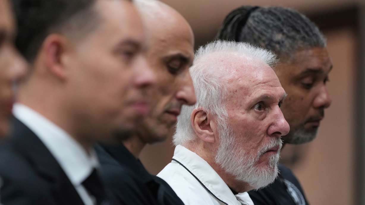 FILE - Former San Antonio Spurs head coach Gregg Popovich, second from right, sits between former players Manu Ginobili and Tim Duncan, right, as he waits to introduce Mitch Johnson, left, as the new head coach of the San Antonio Spurs NBA basketball team, in San Antonio, Monday, May 5, 2025.