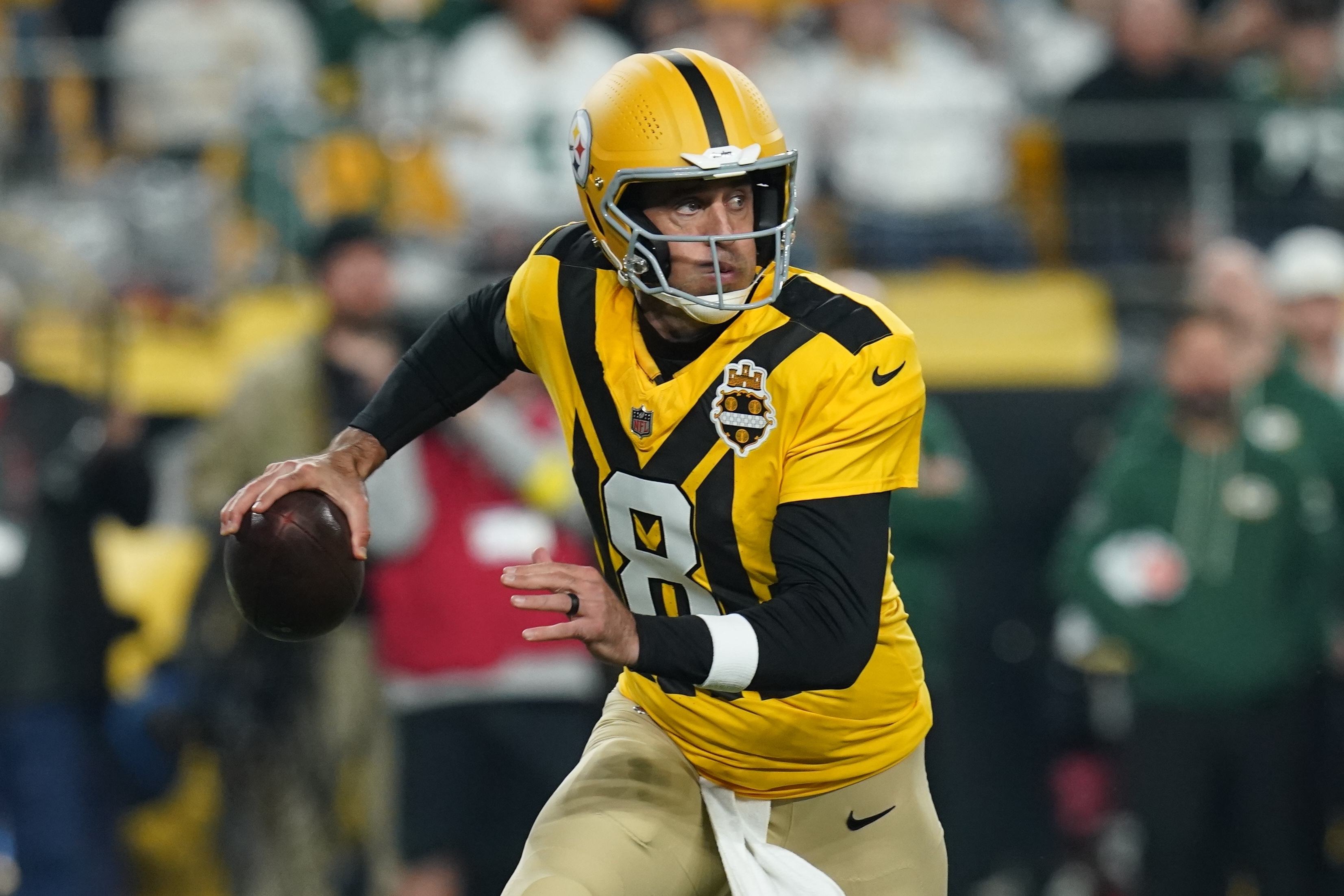Pittsburgh Steelers' Aaron Rodgers scrambles during the first half of an NFL football game against the Green Bay Packers Sunday, Oct. 26, 2025, in Pittsburgh. 