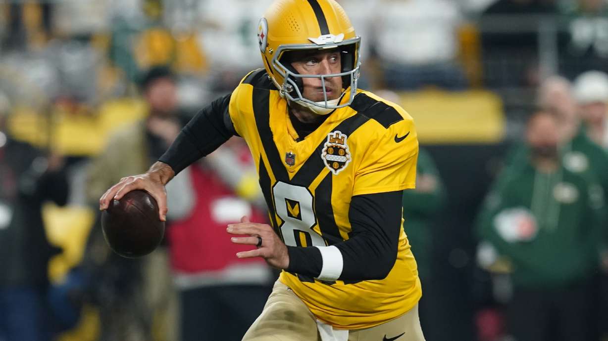 Pittsburgh Steelers' Aaron Rodgers scrambles during the first half of an NFL football game against the Green Bay Packers Sunday, Oct. 26, 2025, in Pittsburgh.