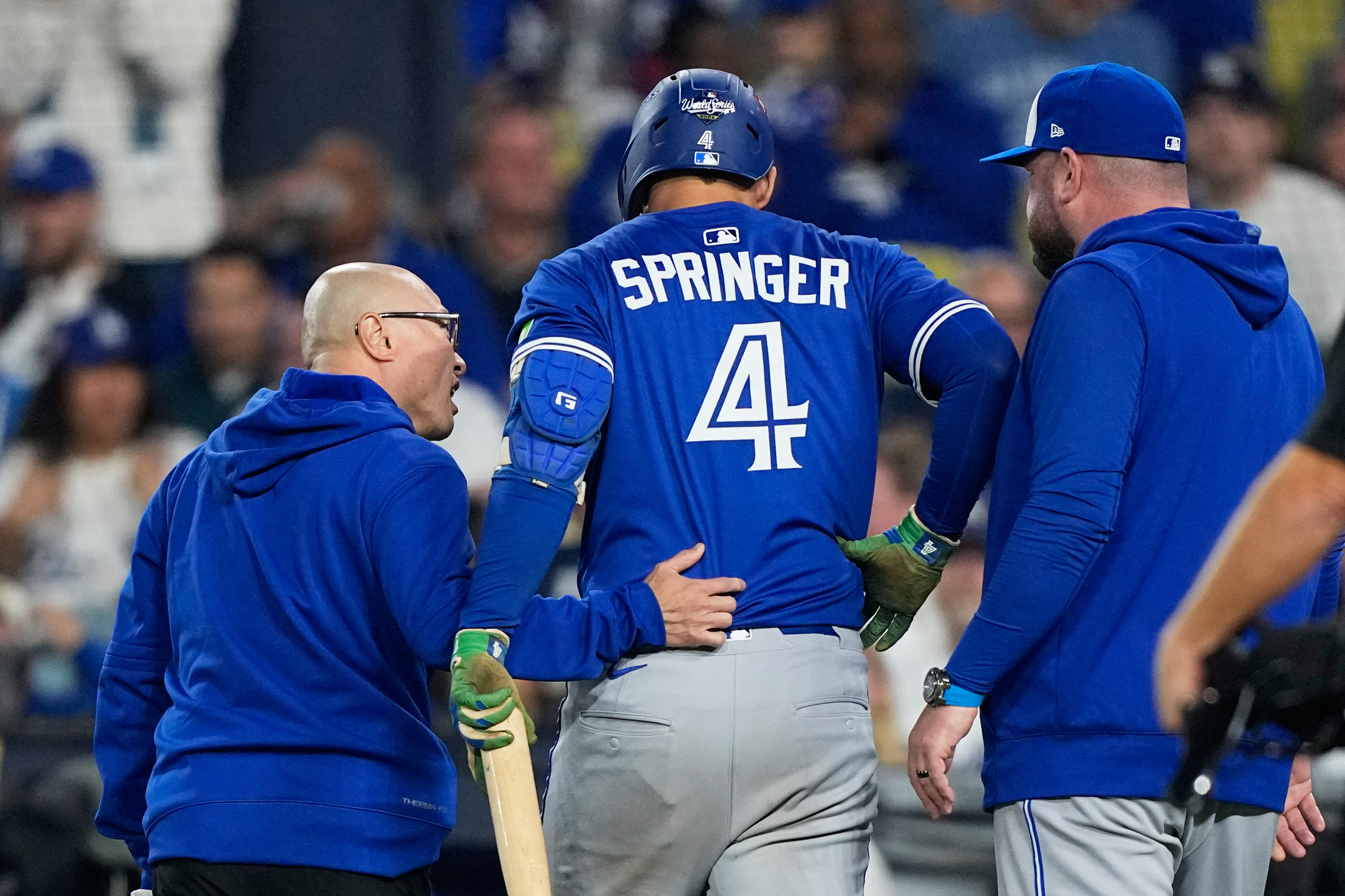 Toronto Blue Jays' George Springer leaves the game with an injury during the seventh inning in Game 3 of baseball's World Series against the Los Angeles Dodgers, Monday, Oct. 27, 2025, in Los Angeles. 
