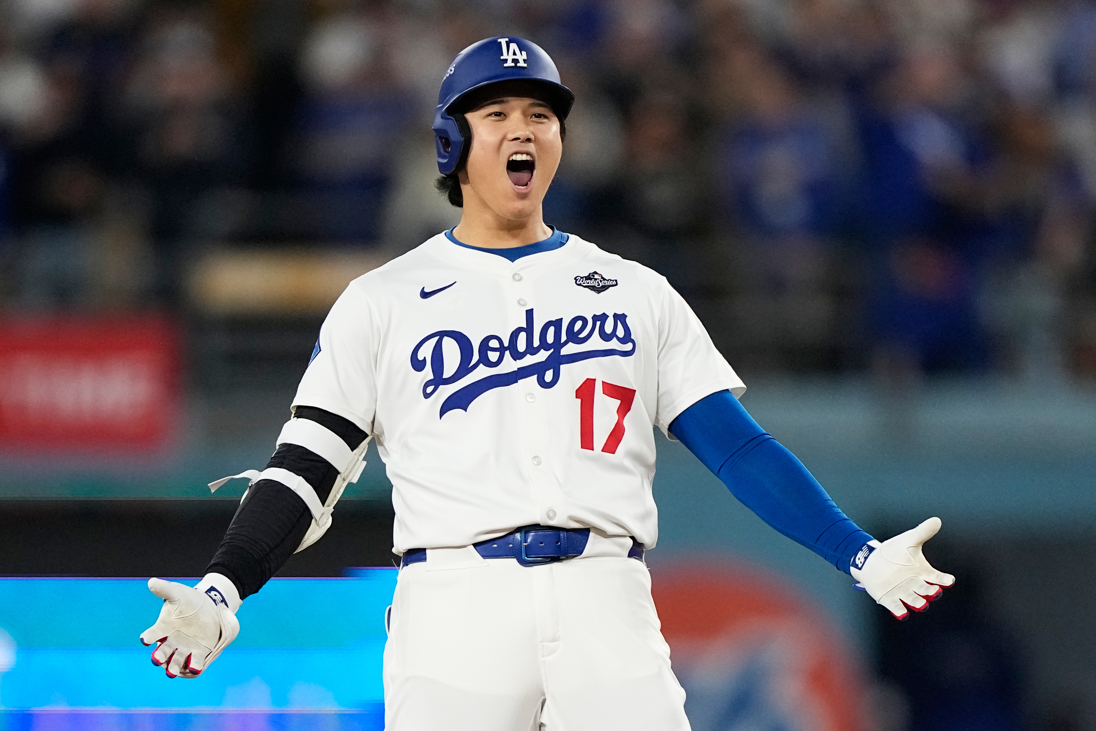 Los Angeles Dodgers' Shohei Ohtani celebrates hit RBI-Double against the Toronto Blue Jays during the fifth inning in Game 3 of baseball's World Series, Monday, Oct. 27, 2025, in Los Angeles. 