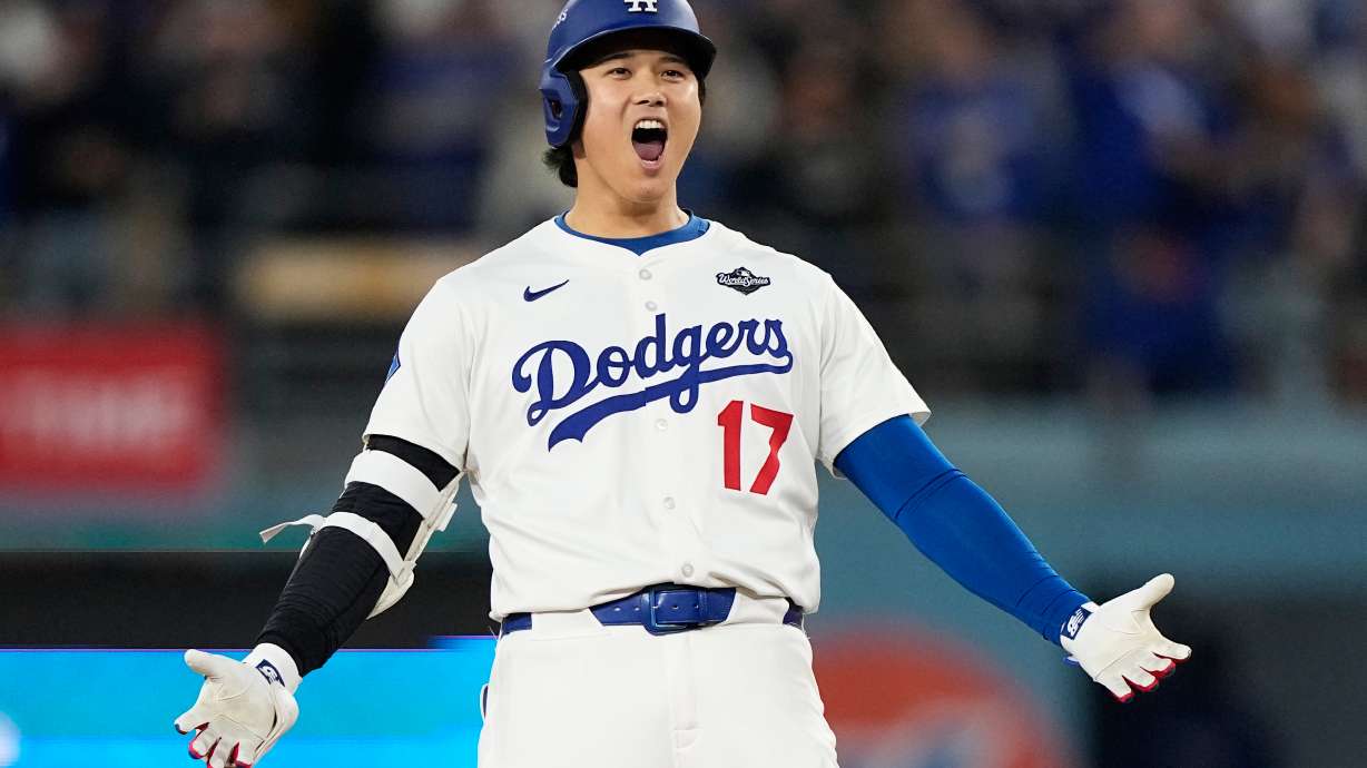 Los Angeles Dodgers' Shohei Ohtani celebrates hit RBI-Double against the Toronto Blue Jays during the fifth inning in Game 3 of baseball's World Series, Monday, Oct. 27, 2025, in Los Angeles.