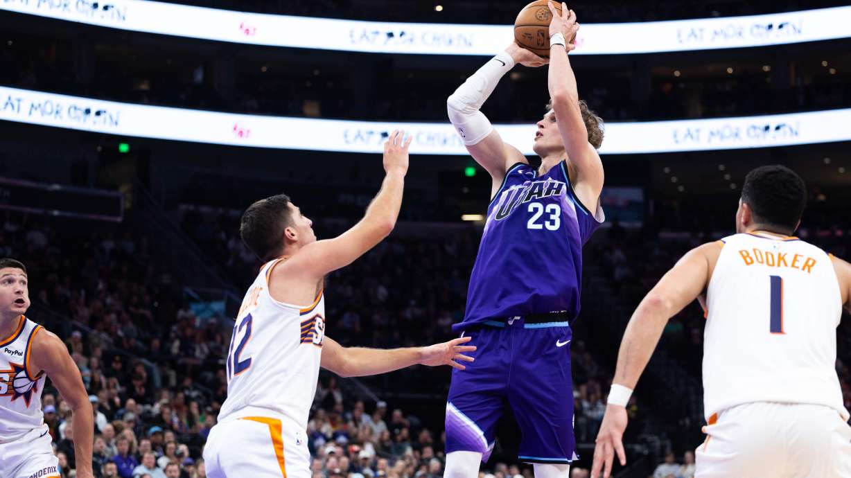 Utah Jazz forward Lauri Markkanen (23) shoots over Phoenix Suns guard Collin Gillespie (12) during the second half of an NBA basketball game, Monday, Oct. 27, 2025, in Salt Lake City.
