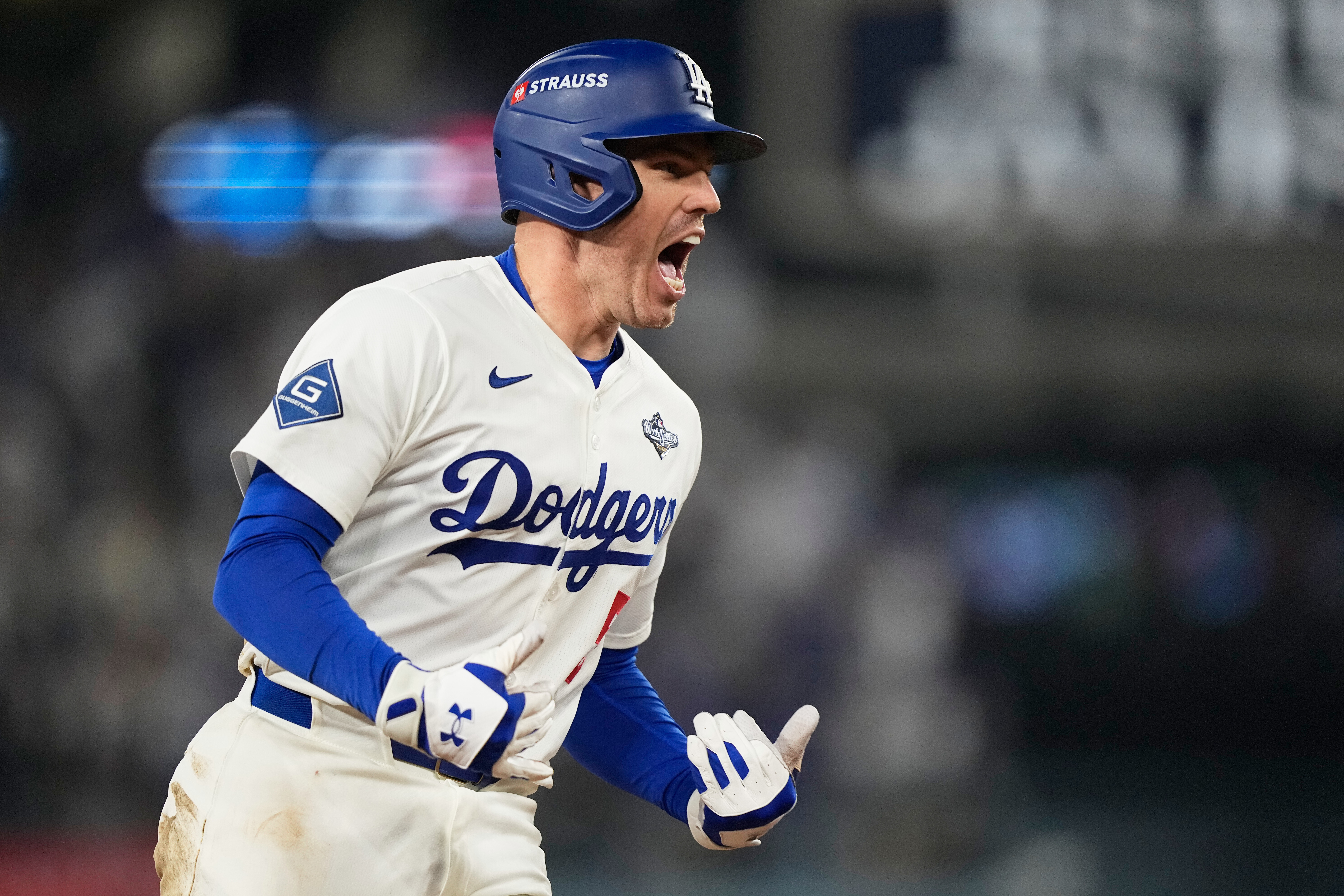 Los Angeles Dodgers' Freddie Freeman celebrates his walk off home run against the Toronto Blue Jays during the 18th inning in Game 3 of baseball's World Series, Monday, Oct. 27, 2025, in Los Angeles.