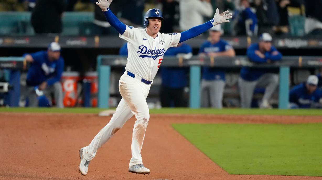 Los Angeles Dodgers' Freddie Freeman celebrates his walk off home run against the Toronto Blue Jays during the 18th inning in Game 3 of baseball's World Series, Monday, Oct. 27, 2025, in Los Angeles.