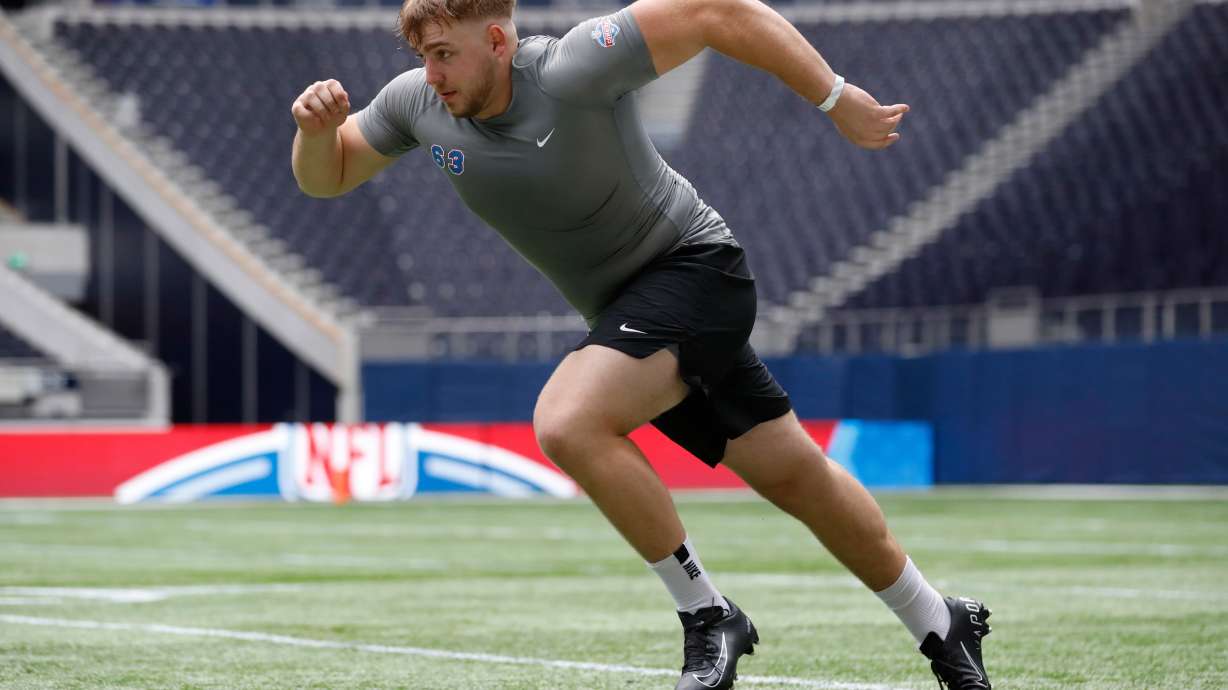 FILE - Offensive lineman Leander Wiegand, of Germany, participates in a drill at the NFL international scouting combine at Tottenham Hotspur Stadium in London, Tuesday, Oct. 4, 2022.