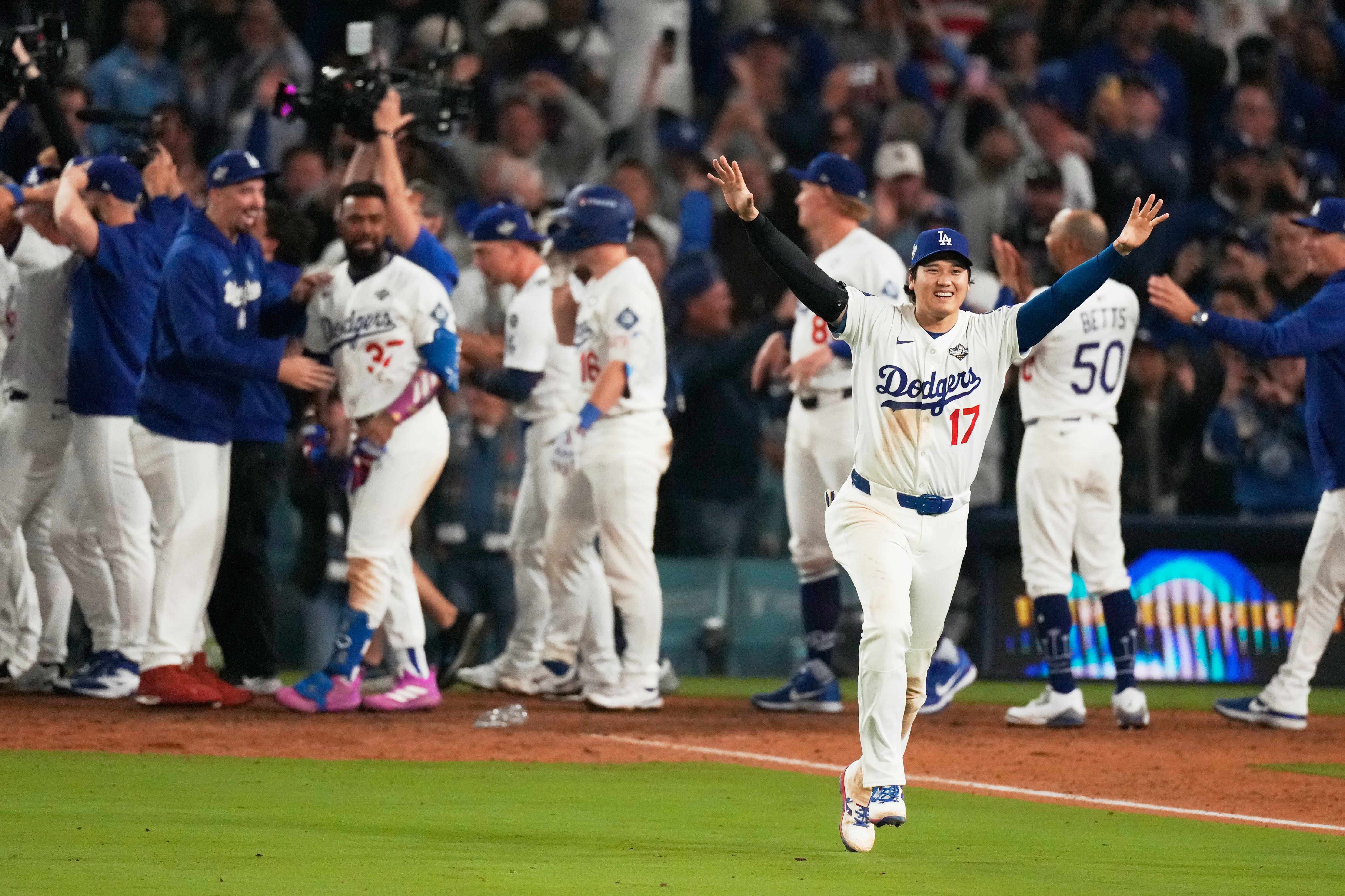 Los Angeles Dodgers' Shohei Ohtani celebrates their win against the Toronto Blue Jays during the 18th inning in Game 3 of baseball's World Series, Monday, Oct. 27, 2025, in Los Angeles. 