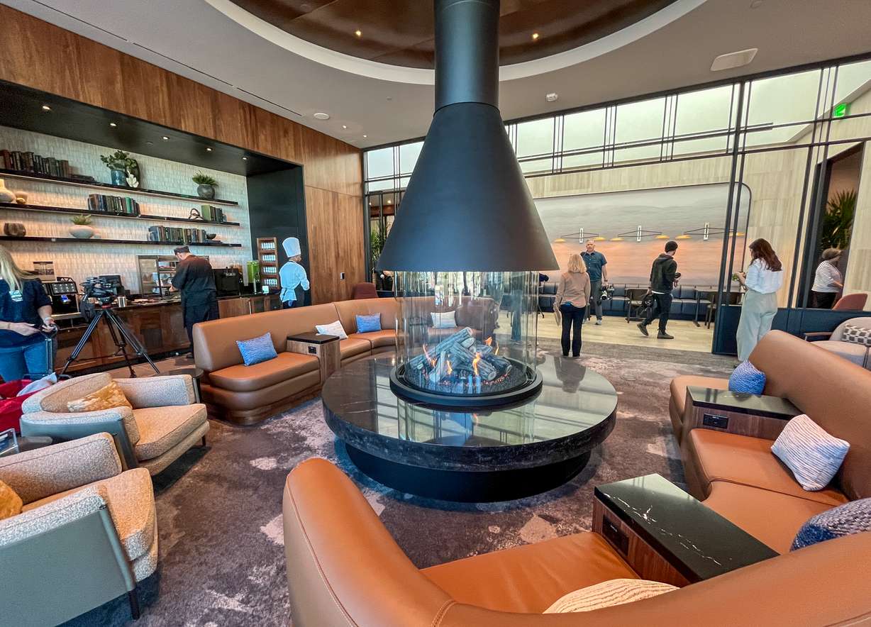 People move through the American Express Centurion Lounge at Salt Lake City International Airport on Tuesday. It's one of two luxury member lounges that opened this week with the latest airport phase completion.