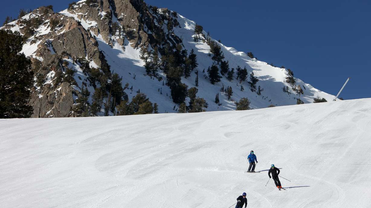 Skiers slide down Snowbasin Resort in Weber County on April 10. The resort landed third on Ski magazine's top resorts in West on Tuesday, leading all resorts in Utah.