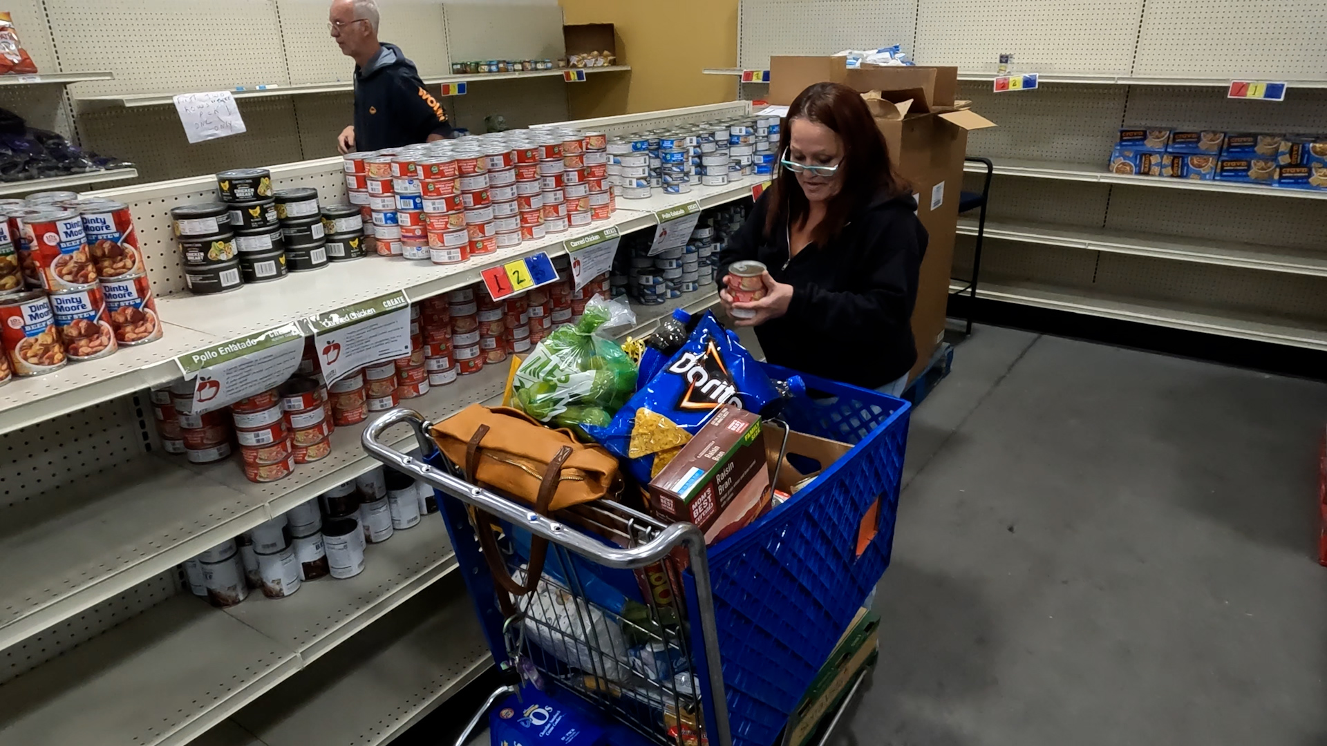 Nunzita Apodaca collects food for her family at the Joyce Hansen Hall Food Bank in Ogden on Tuesday. Apodaca is one of many Utahns who is facing the end of SNAP benefits.