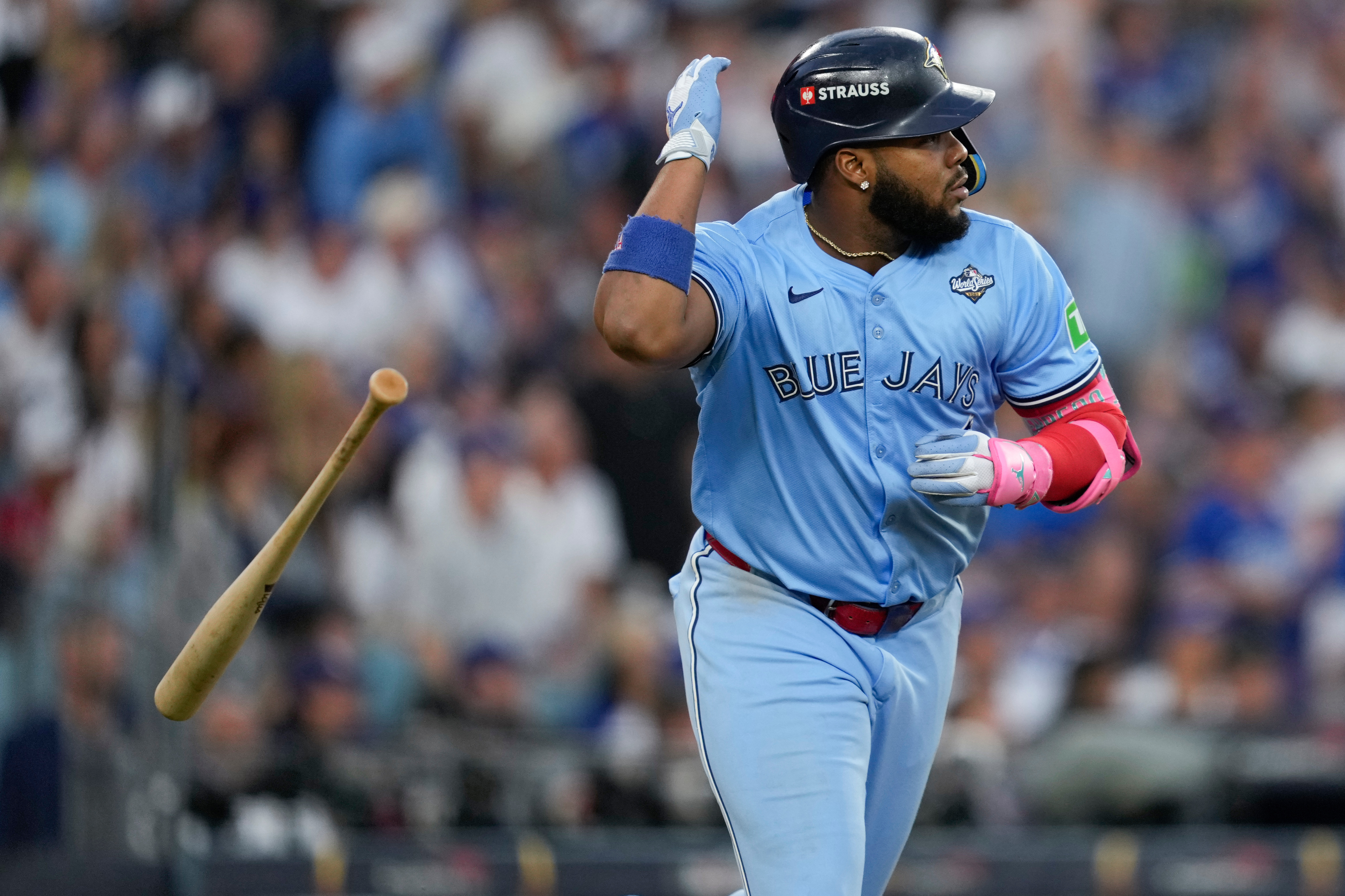 Toronto Blue Jays' Vladimir Guerrero Jr. flips his bat after hitting a two run against the Los Angeles Dodgers during the third inning in Game 4 of baseball's World Series, Tuesday, Oct. 28, 2025, in Los Angeles. 