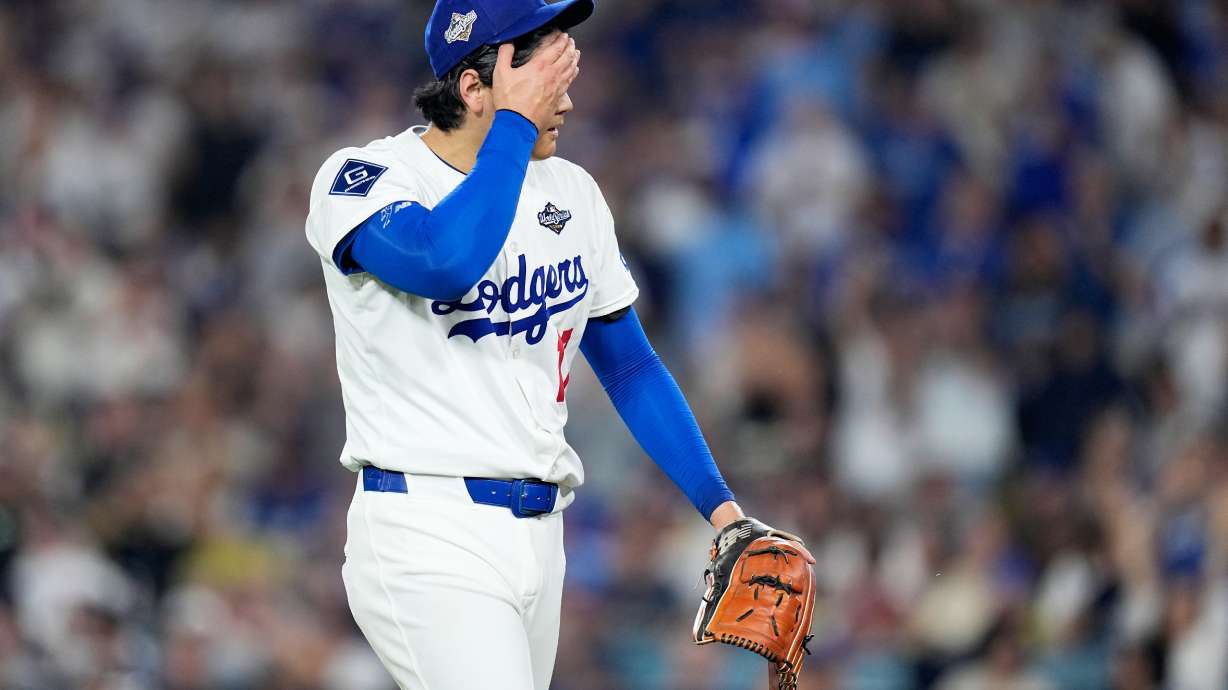 Los Angeles Dodgers pitcher Shohei Ohtani walks to the dugout after striking out Toronto Blue Jays' Alejandro Kirk during the sixth inning in Game 4 of baseball's World Series, Tuesday, Oct. 28, 2025, in Los Angeles.