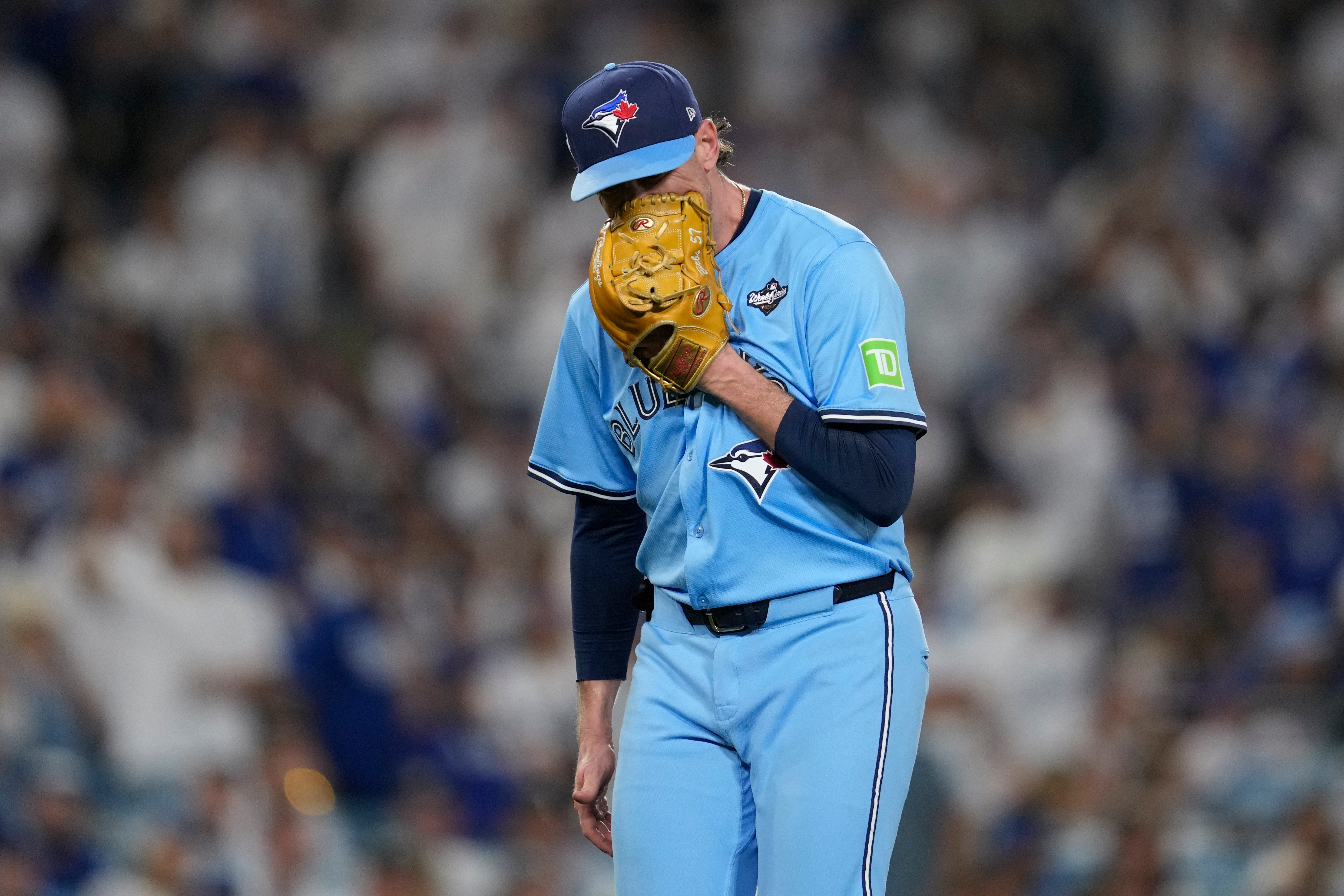 Toronto Blue Jays' pitcher Shane Bieber yells in his glove as he leaves the game during the sixth inning in Game 4 of baseball's World Series against the Los Angeles Dodgers, Tuesday, Oct. 28, 2025, in Los Angeles. 