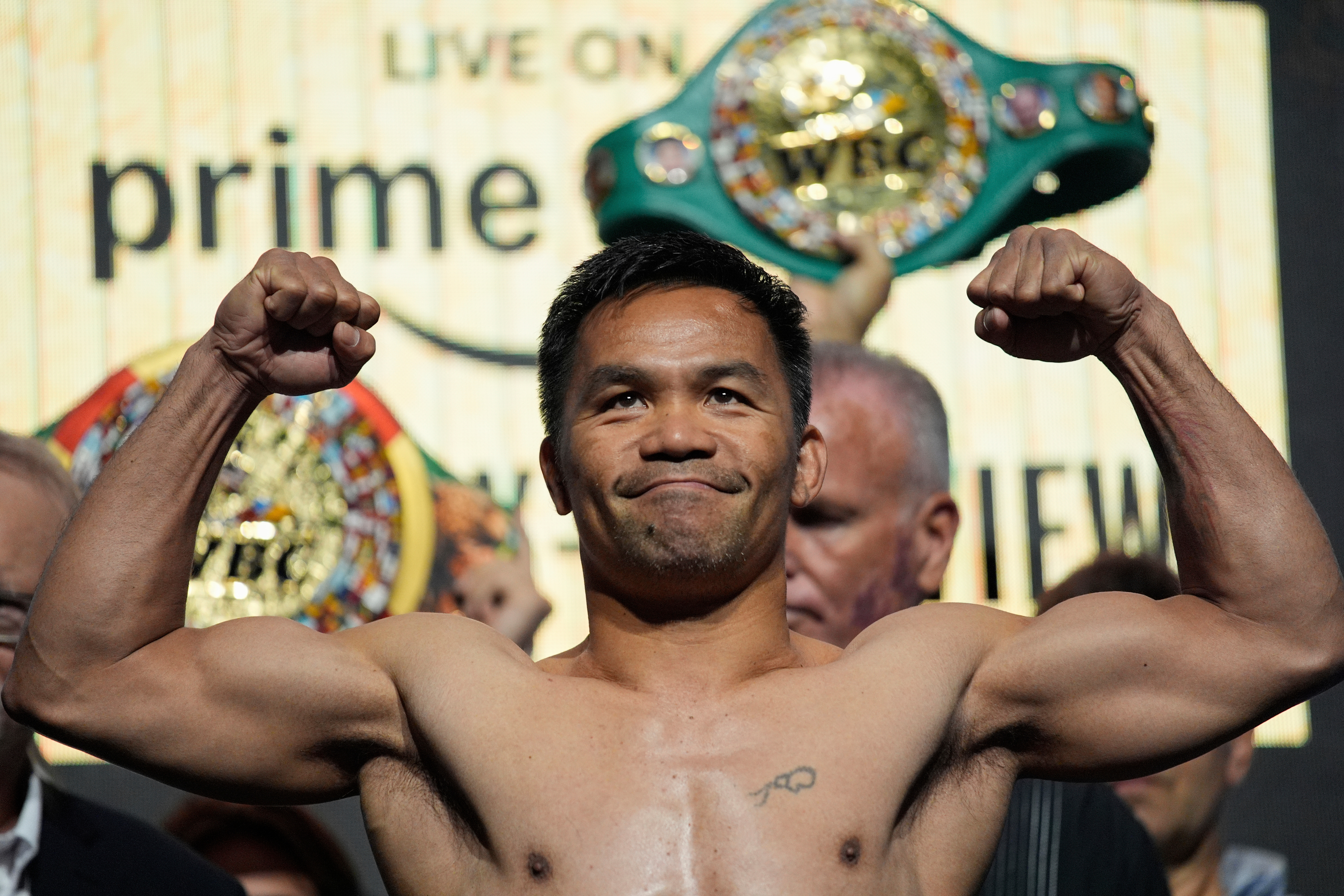 FILE - Manny Pacquiao poses on the scale during a ceremonial weigh in Friday, July 18, 2025, in Las Vegas. 