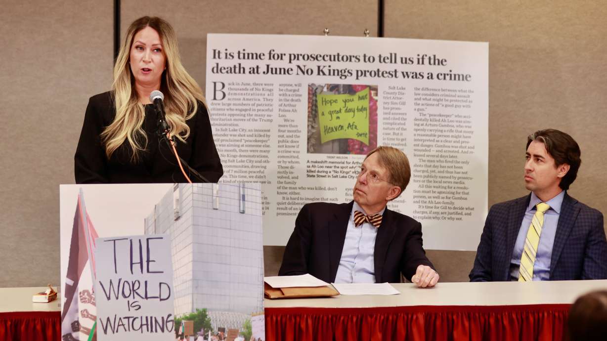 Laura Ah Lo speaks Wednesday about the shooting death of husband, Arthur Folasa "Afa" Ah Loo, during a "No Kings" protest in June in Salt Lake City. Her attorney, Jim McConkie, looks on.