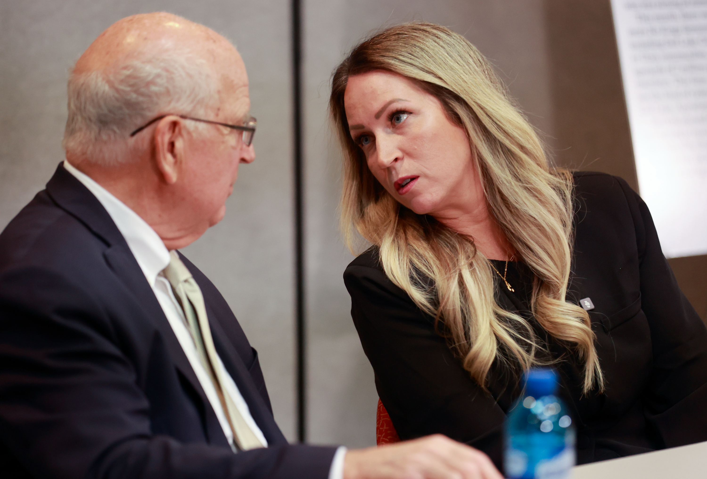 Richard Lambert, of Parker & McConkie and former head of the criminal division in the U.S. Attorney’s Office of Utah, talks with Laura Ah Loo, widow of Afa Ah Loo, who was killed as an innocent bystander at a "No Kings" rally in June, during a press conference at the Utah State Bar in Salt Lake City on Wednesday.