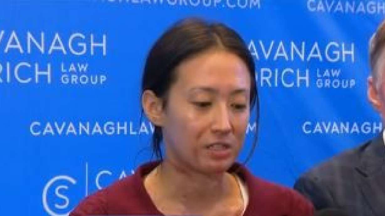 Kira Bond speaks at a news conference in Chicago, Wednesday. Bond is one of several people suing the Offshore Rooftop restaurant at Chicago's Navy Pier, after being burned when a s'mores station flashed over in flames during a corporate event.