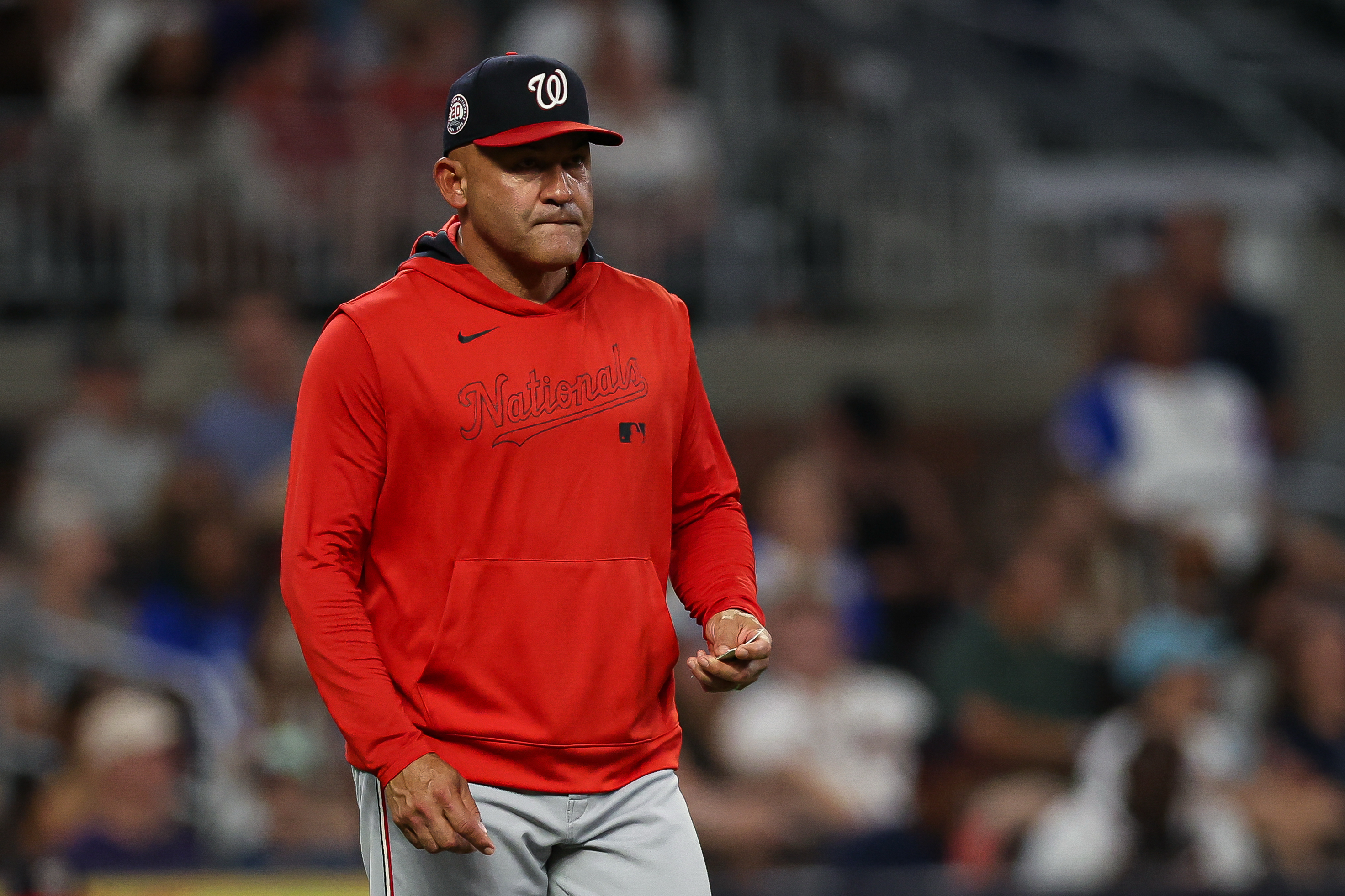 FILE - Washington Nationals interim manager Miguel Cairo walks out to the mound to make a pitching change in the seventh inning of a baseball game against the Atlanta Braves, Tuesday, Sept. 23, 2025, in Atlanta. 