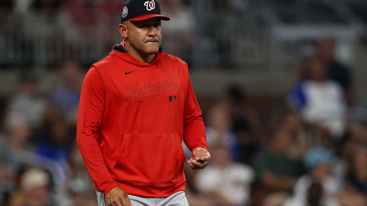 FILE - Washington Nationals interim manager Miguel Cairo walks out to the mound to make a pitching change in the seventh inning of a baseball game against the Atlanta Braves, Tuesday, Sept. 23, 2025, in Atlanta.