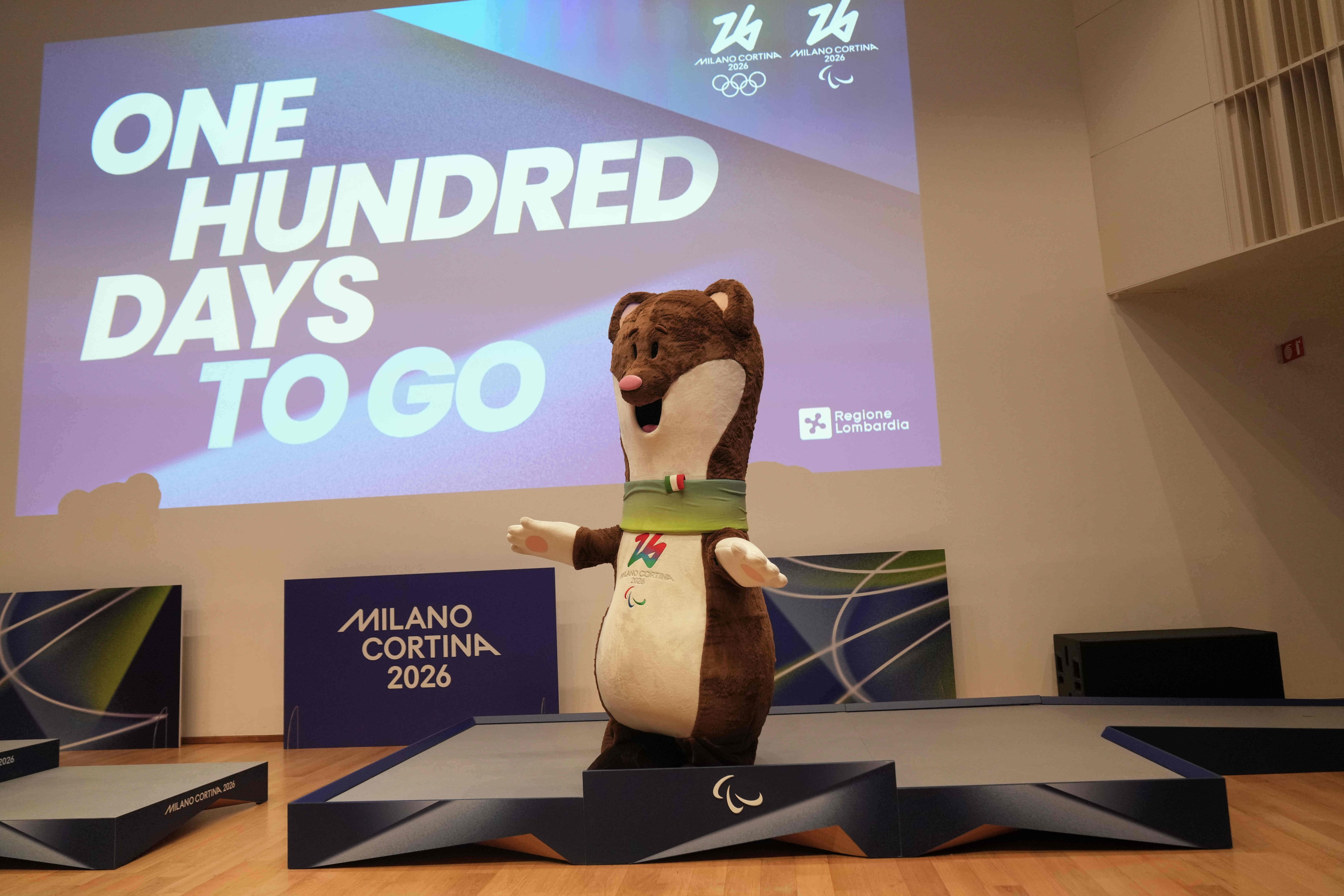 2026 Milan Cortina Winter Olympic podiums are unveiled in Milan, Italy, Wednesday, with the mascots Tina and Milo. Wednesday marked 100 days until the start of the Games.