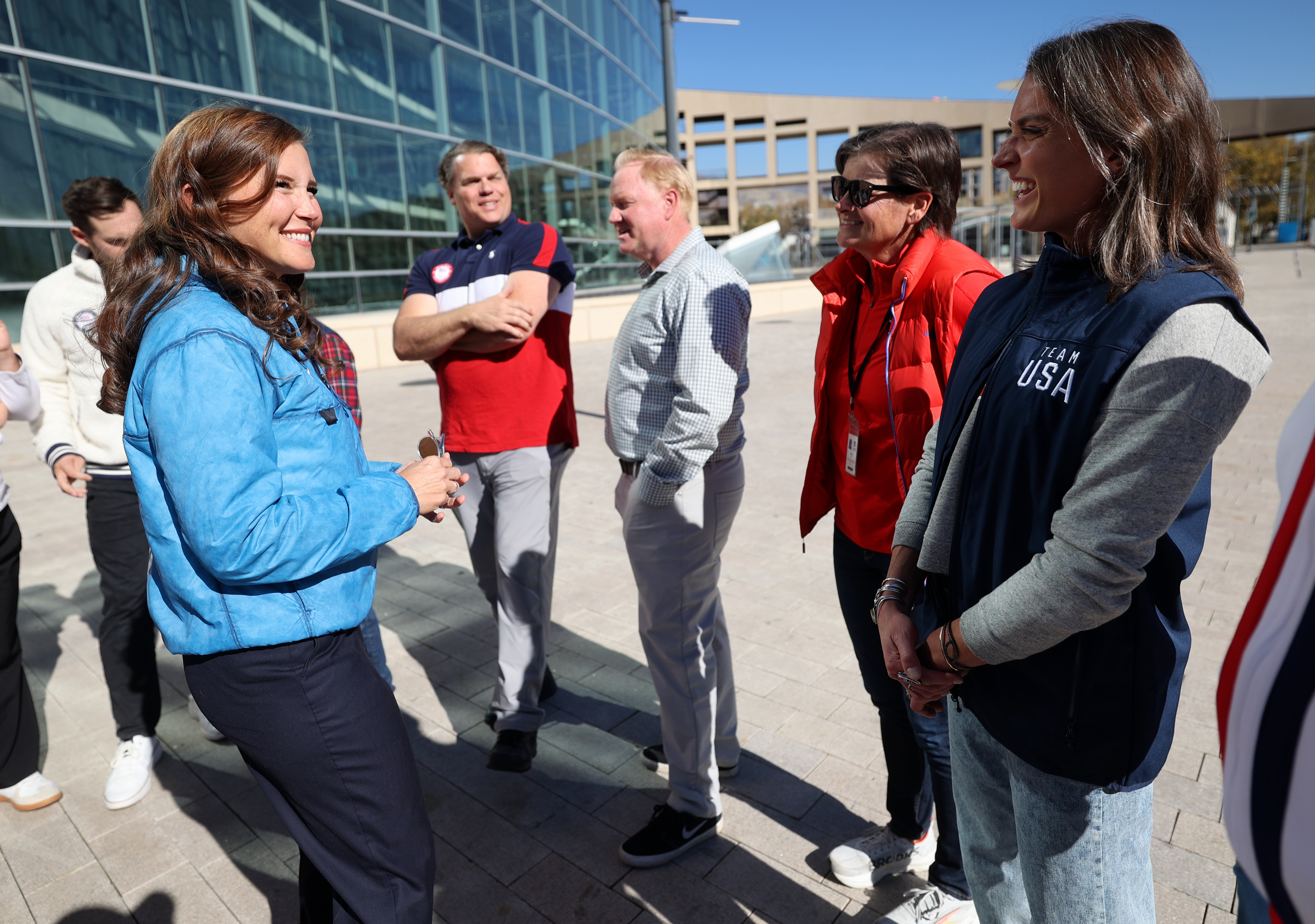 Salt Lake City Mayor Erin Mendenhall talks with Tanja Kari, Finnish Paralympic gold medalist in cross-country skiing, and Aly Dudek, short track speed skater and Olympic bronze medallist, after a press conference to announce a public watch party for the Milan-Cortina 2026 Winter Olympic and Paralympic Games at Library Square in Salt Lake City on Wednesday.