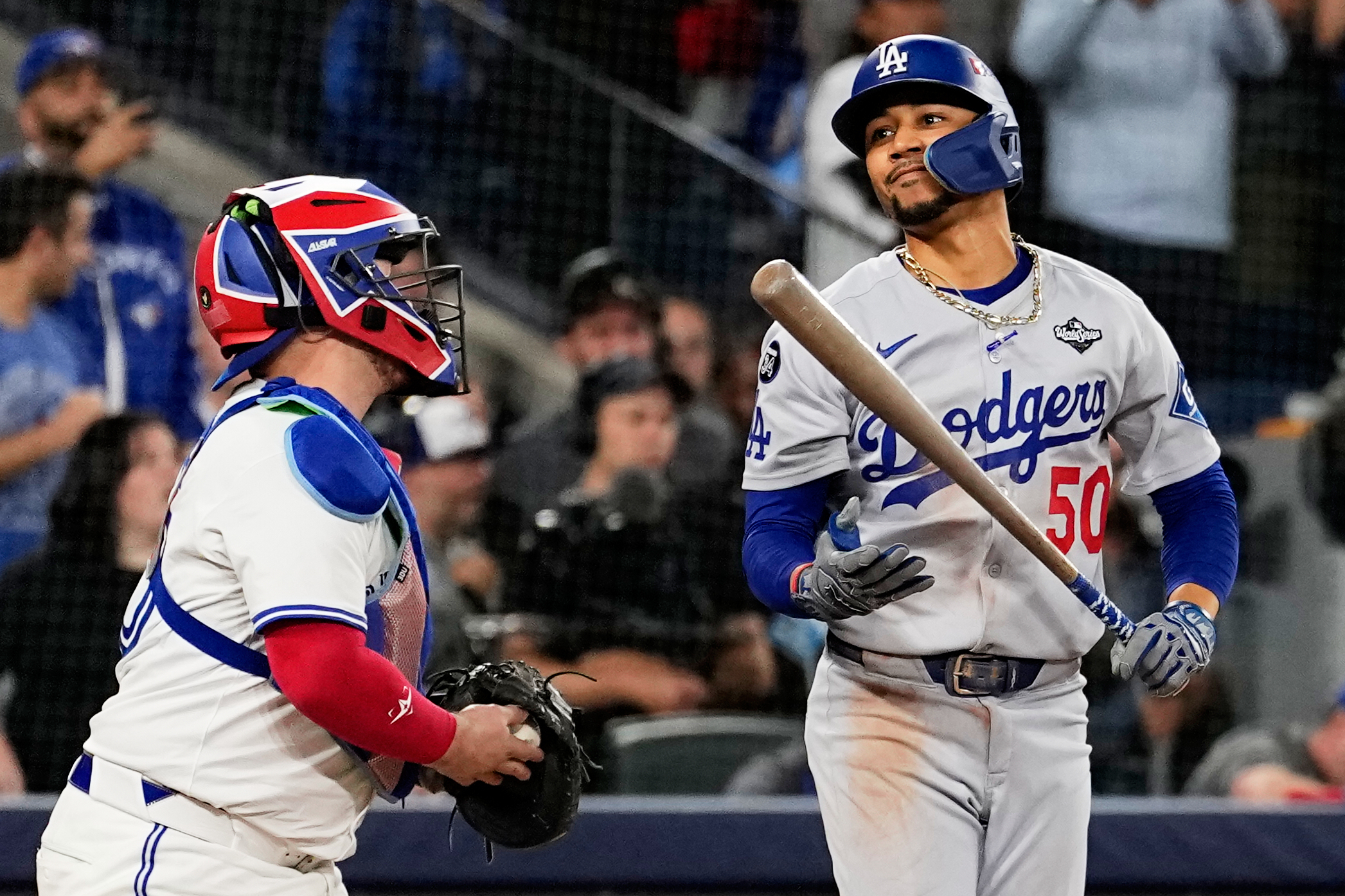 Los Angeles Dodgers' Mookie Betts reacts after striking out against the Toronto Blue Jays to end Game 1 of baseball's World Series, Friday, Oct. 24, 2025, in Toronto. 