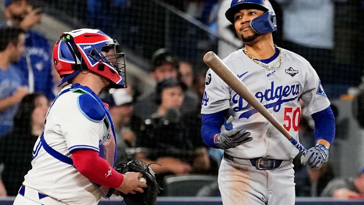 Los Angeles Dodgers' Mookie Betts reacts after striking out against the Toronto Blue Jays to end Game 1 of baseball's World Series, Friday, Oct. 24, 2025, in Toronto.