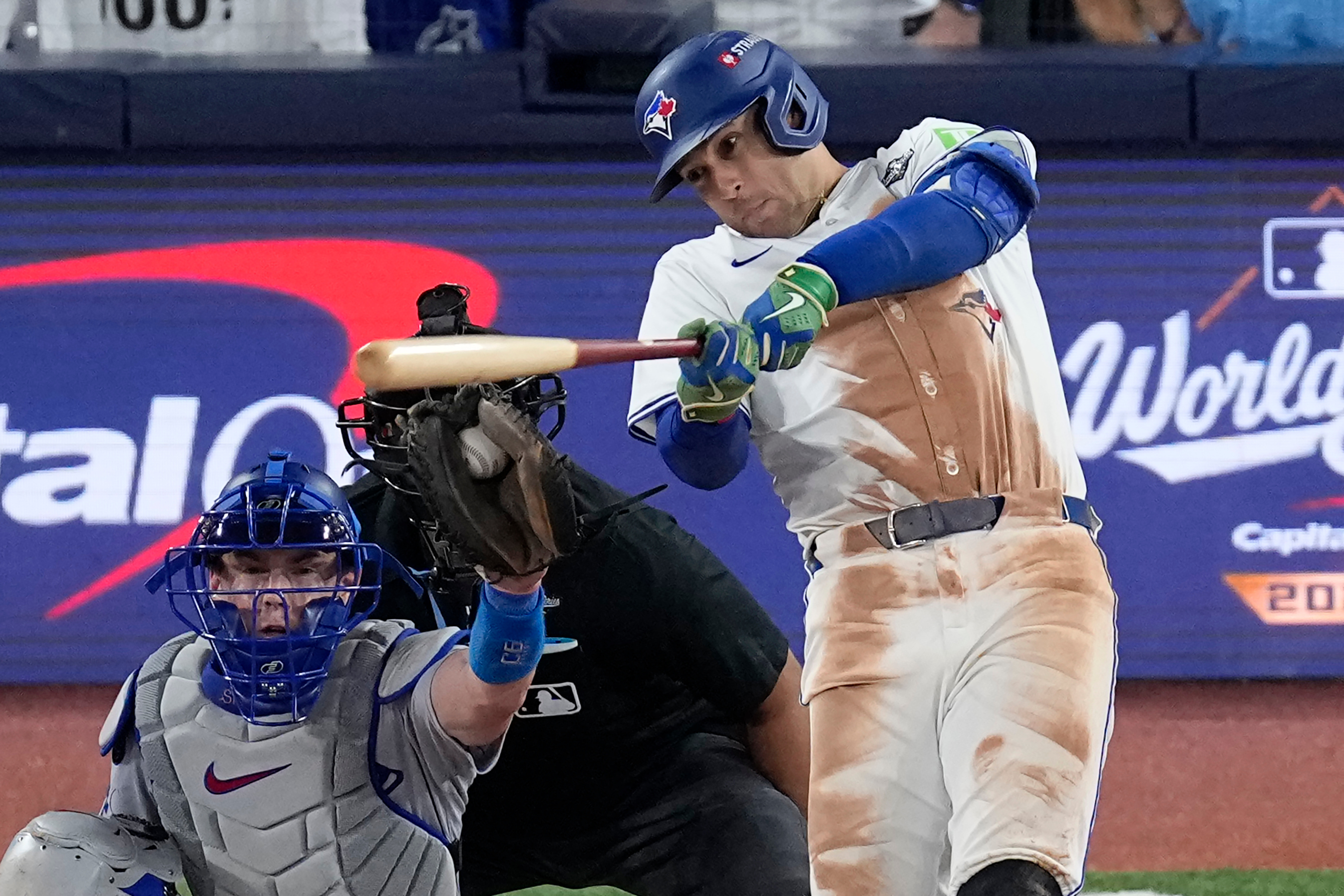 Toronto Blue Jays' George Springer strikes out during the eighth inning in Game 2 of baseball's World Series against the Los Angeles Dodgers, Saturday, Oct. 25, 2025, in Toronto. 