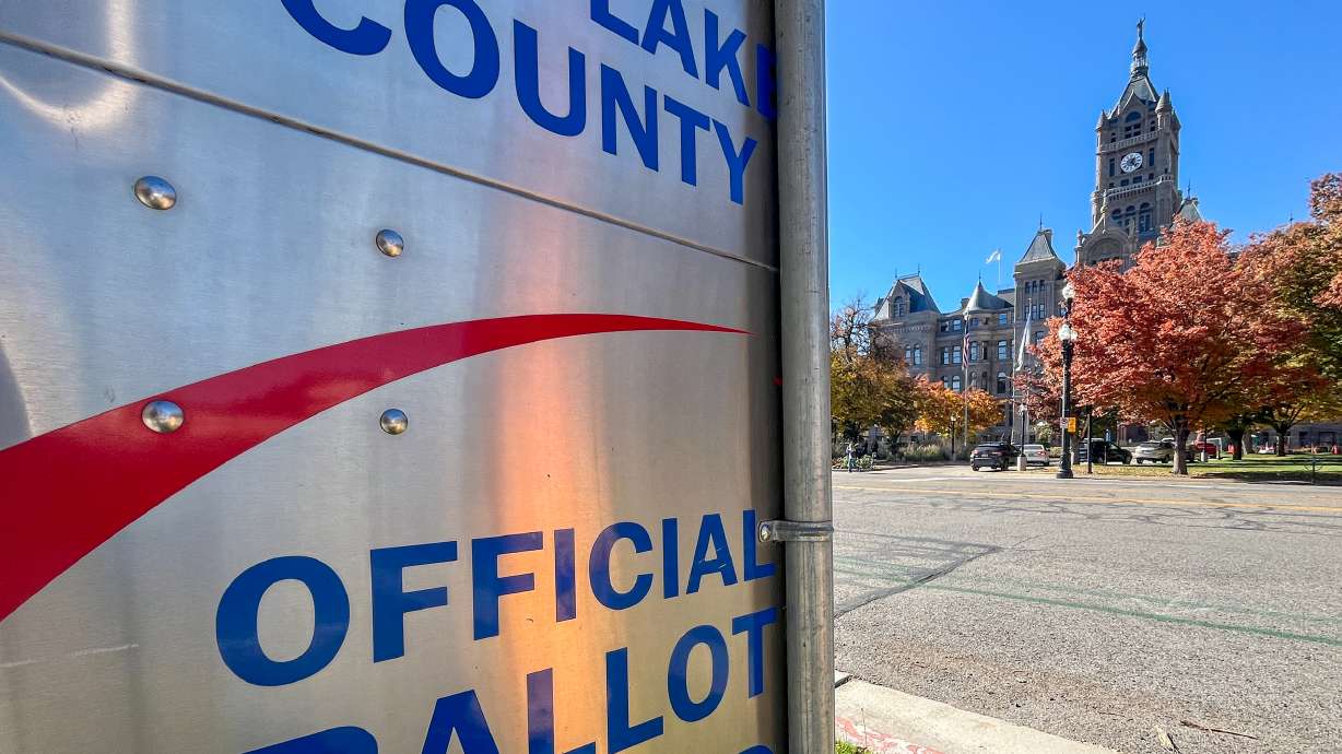 The Salt Lake City-County Building, home to Salt Lake City Hall, is pictured behind a Salt Lake County ballot dropoff box on Wednesday. Four of the city's seven City Council seats are up for grabs next week.