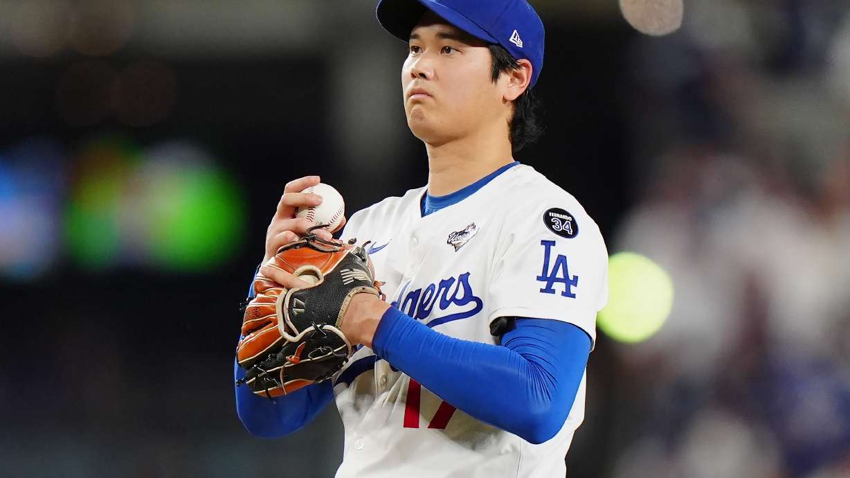 Los Angeles Dodgers pitcher Shohei Ohtani (17) reacts after giving up a double during seventh inning Game 4 World Series playoff MLB baseball action against the Toronto Blue Jays in Los Angeles on Tuesday, Oct. 28, 2025.