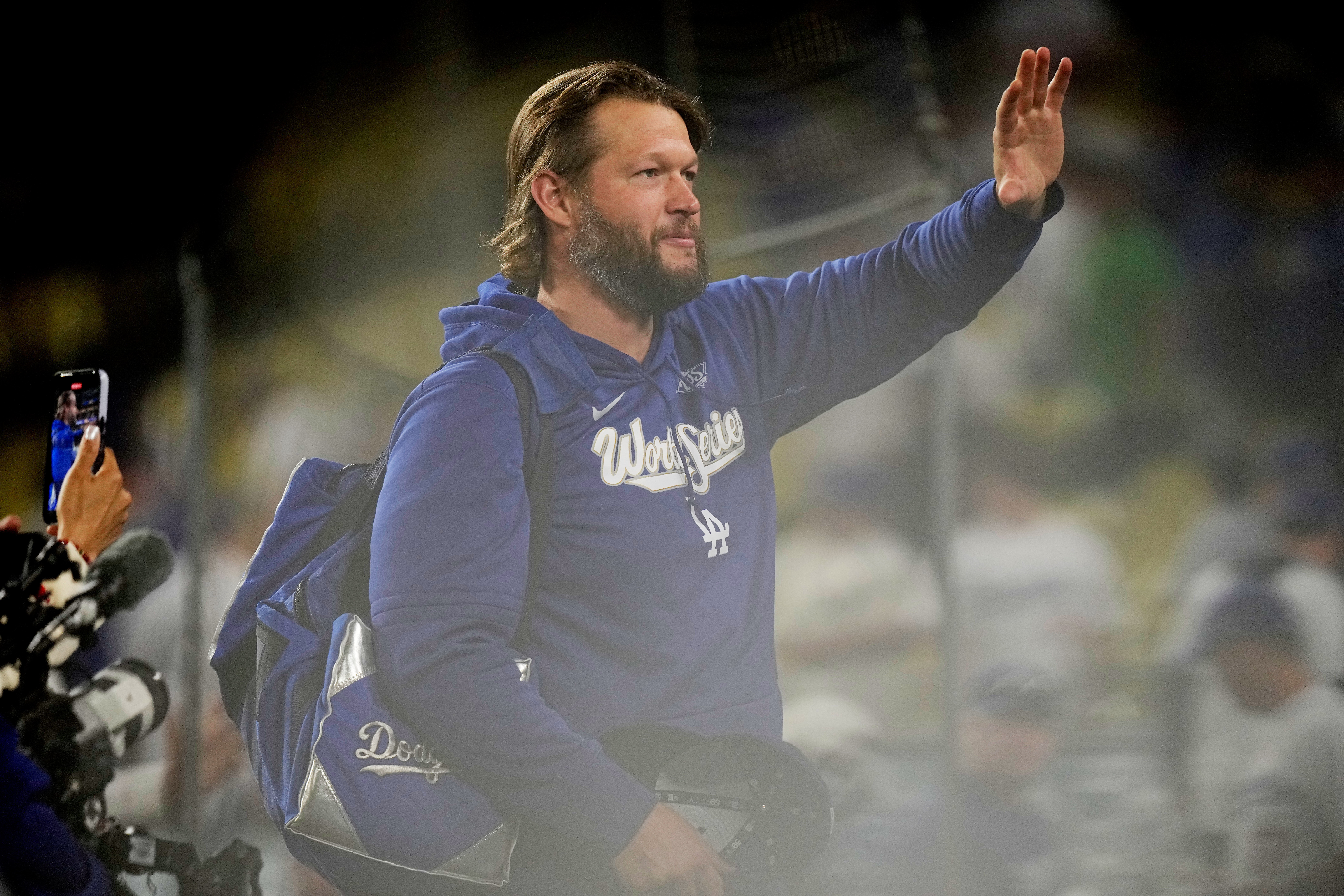 Los Angeles Dodgers pitcher Clayton Kershaw waves after their loss against the Toronto Blue Jays in Game 5 of baseball's World Series, Wednesday, Oct. 29, 2025, in Los Angeles. 