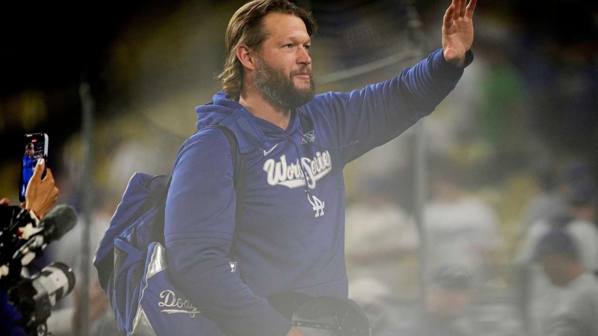 Los Angeles Dodgers pitcher Clayton Kershaw waves after their loss against the Toronto Blue Jays in Game 5 of baseball's World Series, Wednesday, Oct. 29, 2025, in Los Angeles.