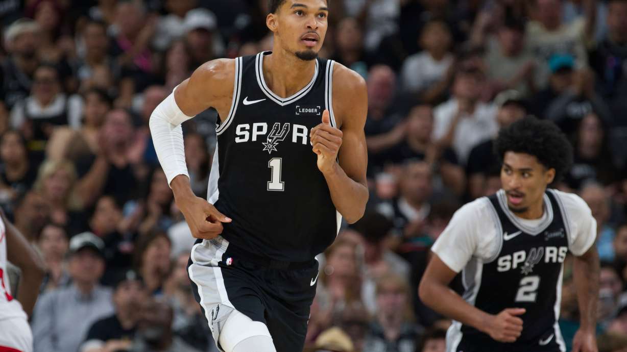San Antonio Spurs center Victor Wembanyama (1) runs up-court during the second half of an NBA basketball game against the Toronto Raptors, Monday, Oct. 27, 2025, in San Antonio.