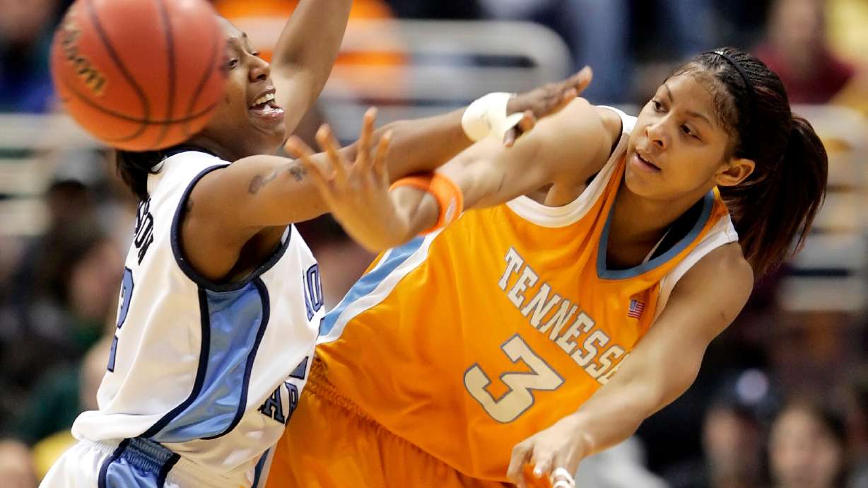FILE - Tennessee's Candace Parker (3) passes around North Carolina's La'Tangela Atkinson in the first half of the NCAA college basketball tournament regional final, Tuesday, March 28, 2006, in Cleveland.