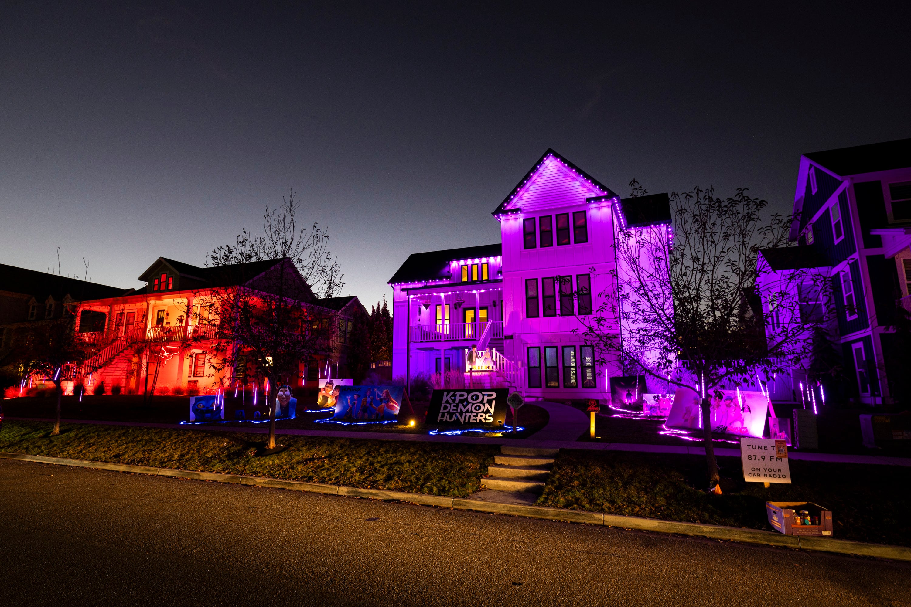Decorations from "KPop Demon Hunters" are displayed on Chelsey Vreeken's house at 5058 W. Beach Comber Way in South Jordan on Tuesday. The setup includes projections and a personal FM radio station with songs from the film.