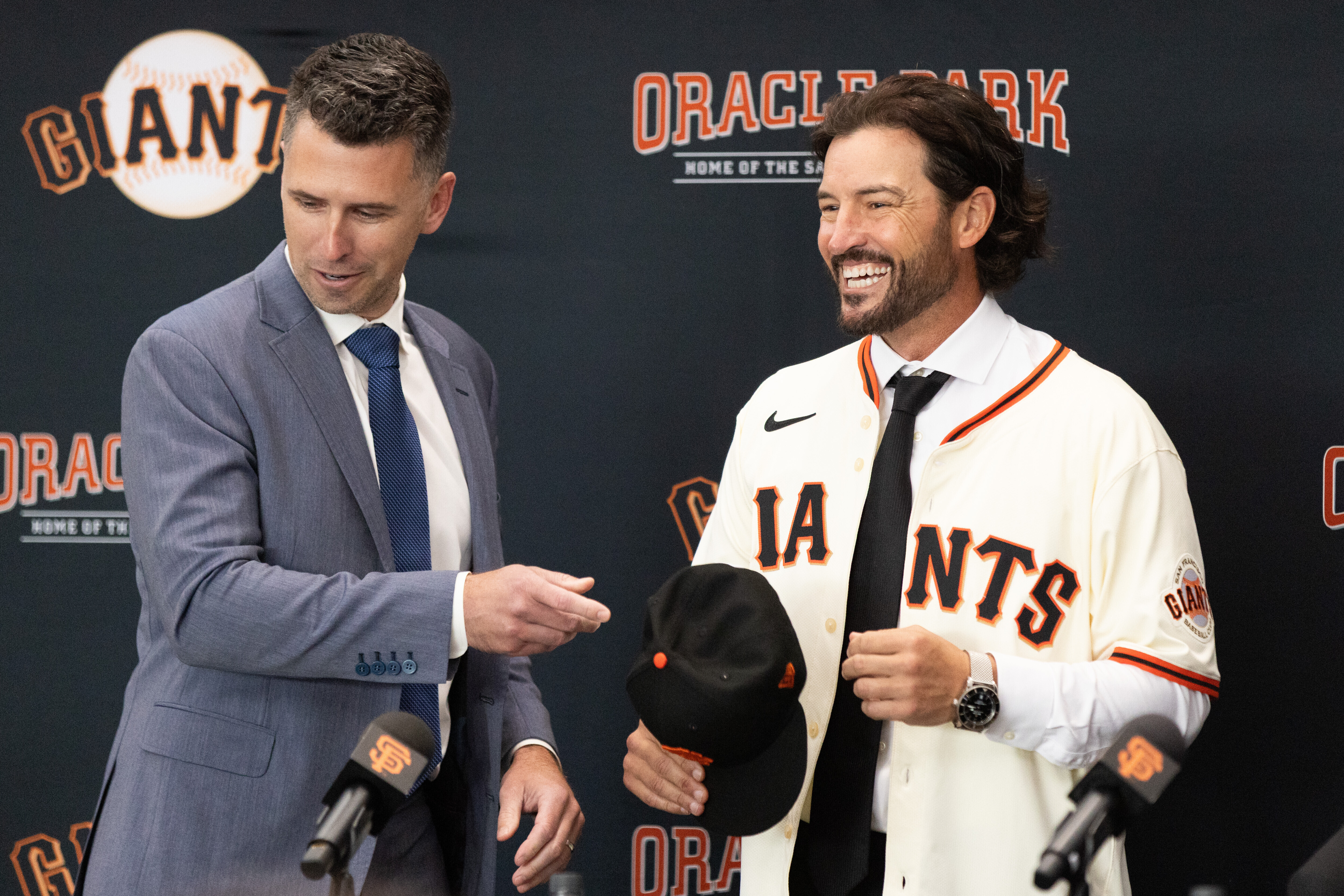 San Francisco Giants President of Baseball Operations Buster Posey, left, welcomes Tony Vitello as the new manager of the San Francisco Giants baseball team on Thursday, Oct. 30, 2025, in San Francisco. 