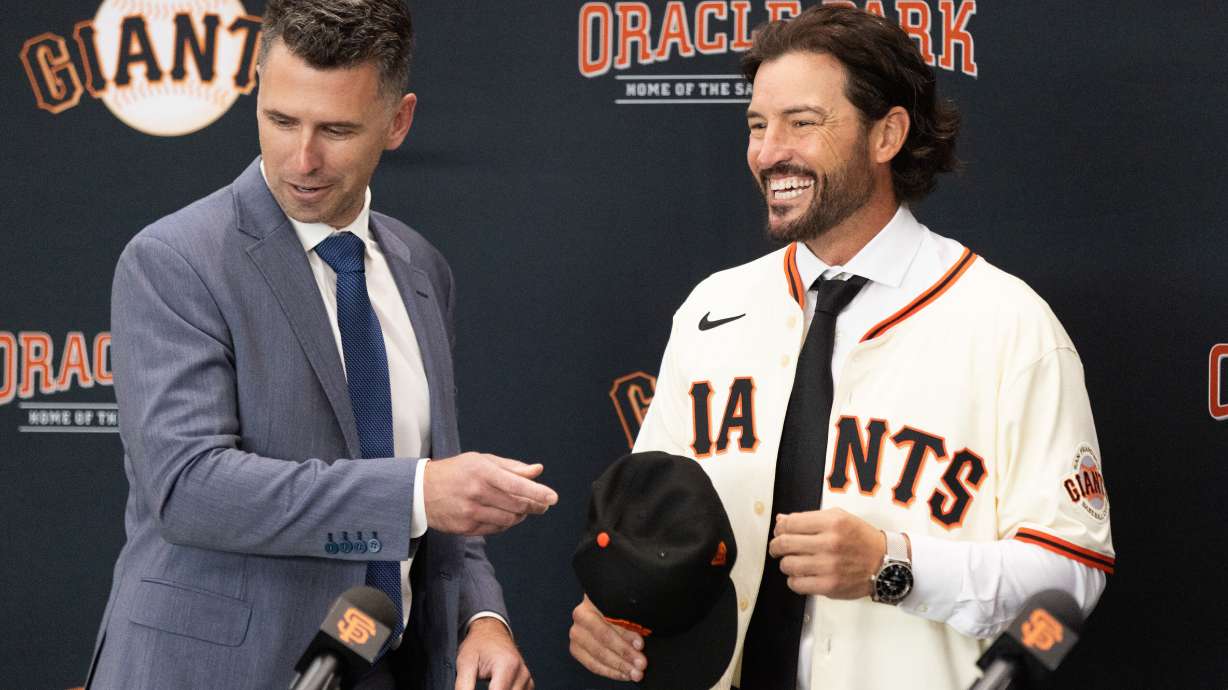 San Francisco Giants President of Baseball Operations Buster Posey, left, welcomes Tony Vitello as the new manager of the San Francisco Giants baseball team on Thursday, Oct. 30, 2025, in San Francisco.