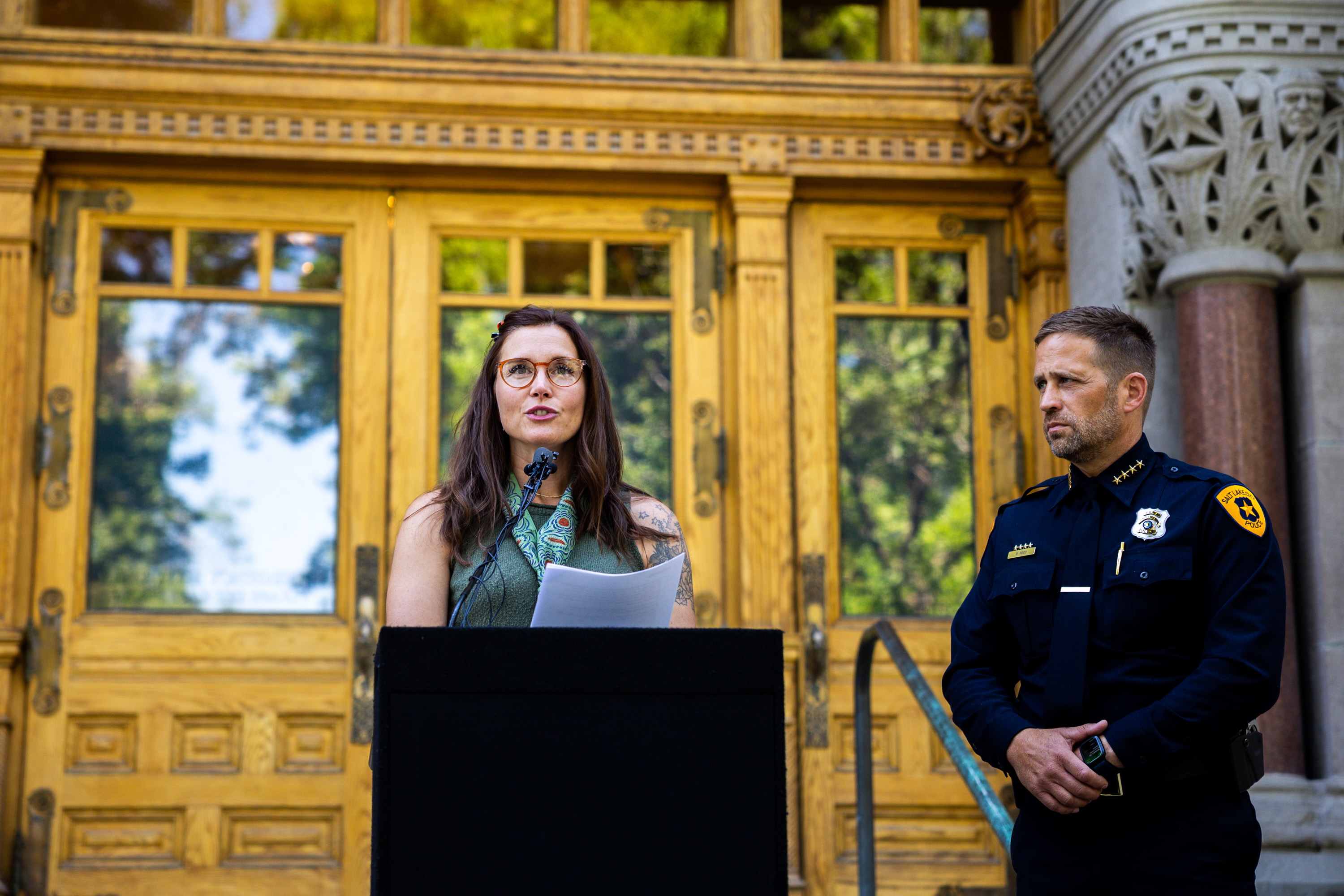 Salt Lake City Mayor Erin Mendenhall speaks next to Salt Lake City Police Chief Brian Redd outside Salt Lake City Hall in Salt Lake City on Aug. 13. Redd was sworn in as the city's new police chief in March.