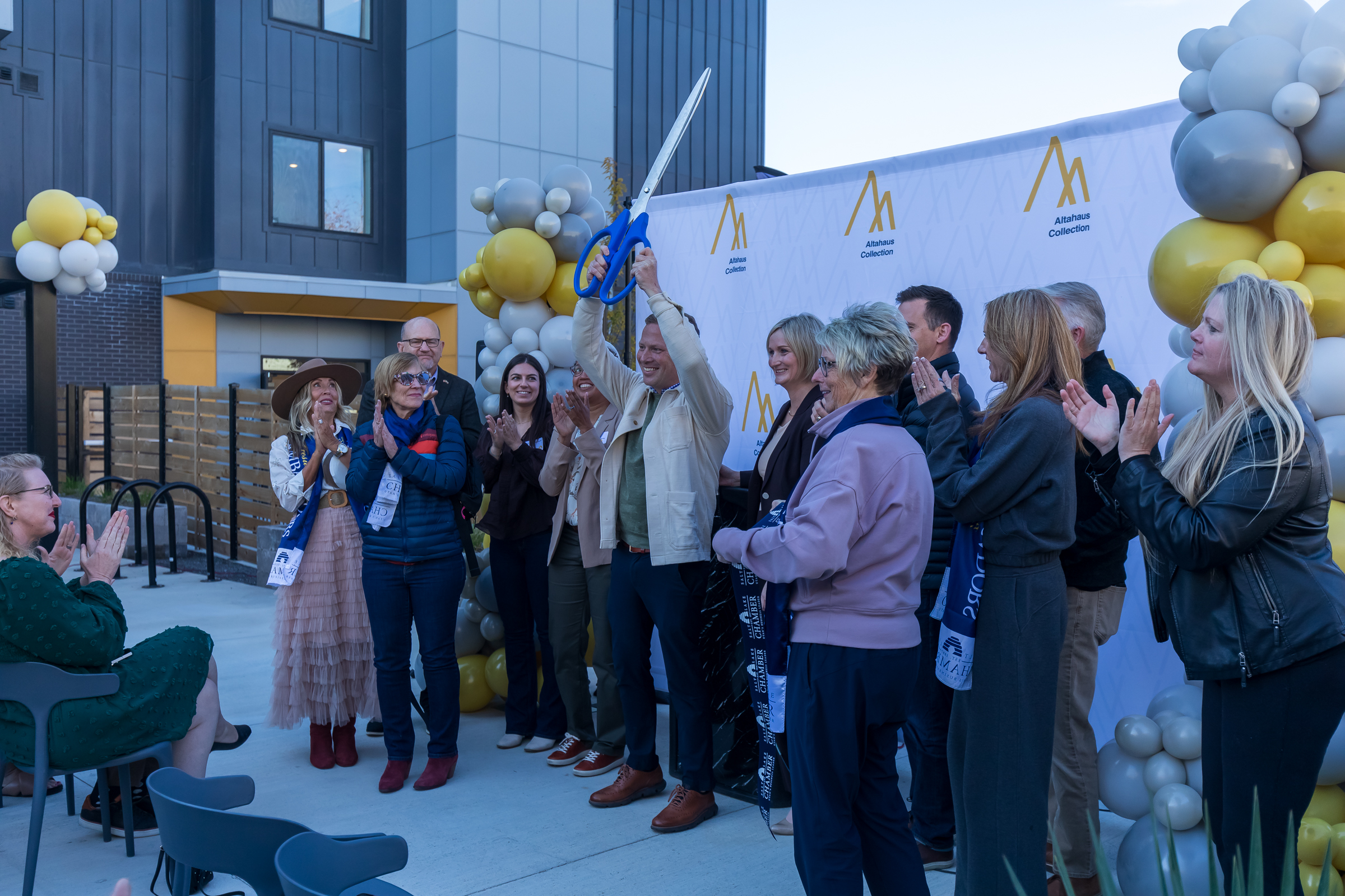 Alta Vue project leaders and supports cut a ribbon to celebrate the opening of the Salt Lake City apartment complex on Thursday.