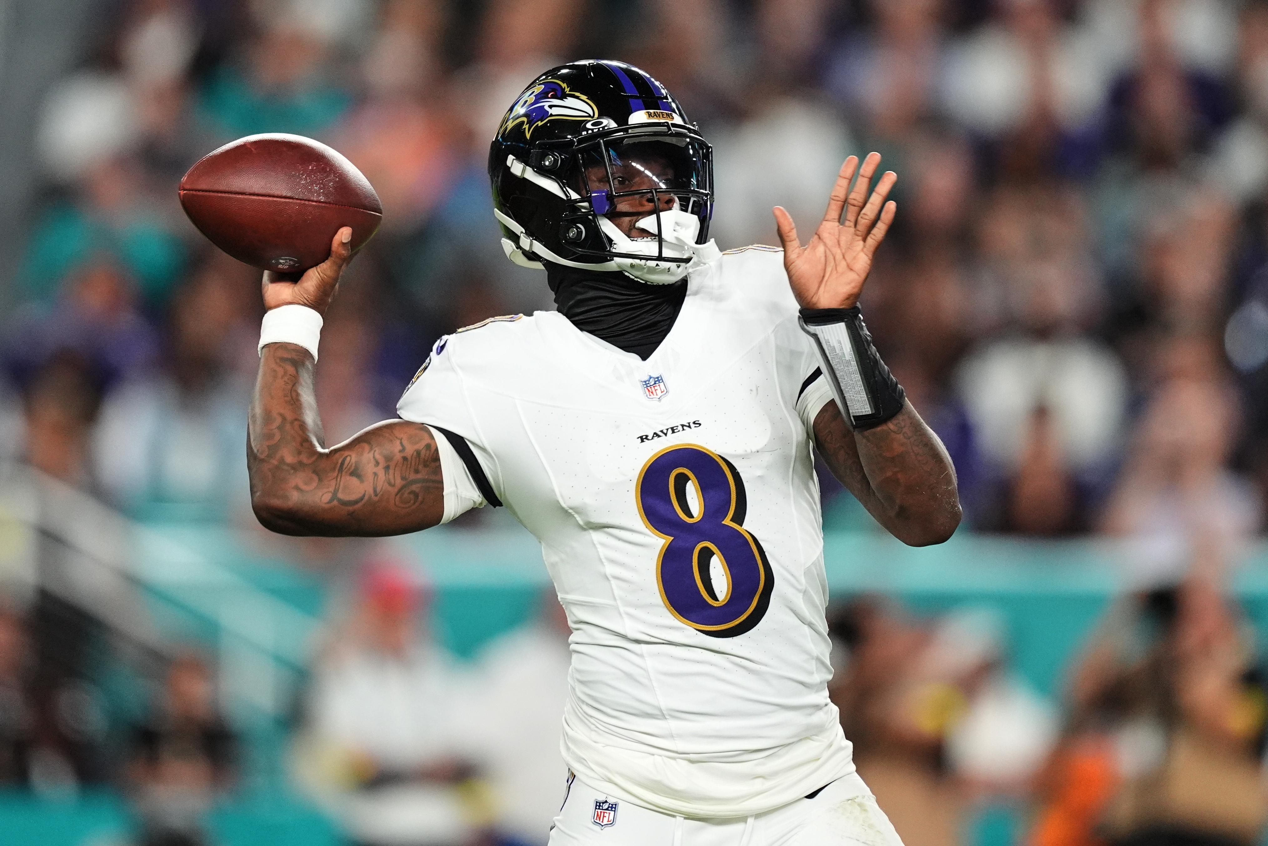 Baltimore Ravens quarterback Lamar Jackson (8) throws against the Miami Dolphins during the first half of an NFL football game, Thursday, Oct. 30, 2025, in Miami Gardens, Fla.