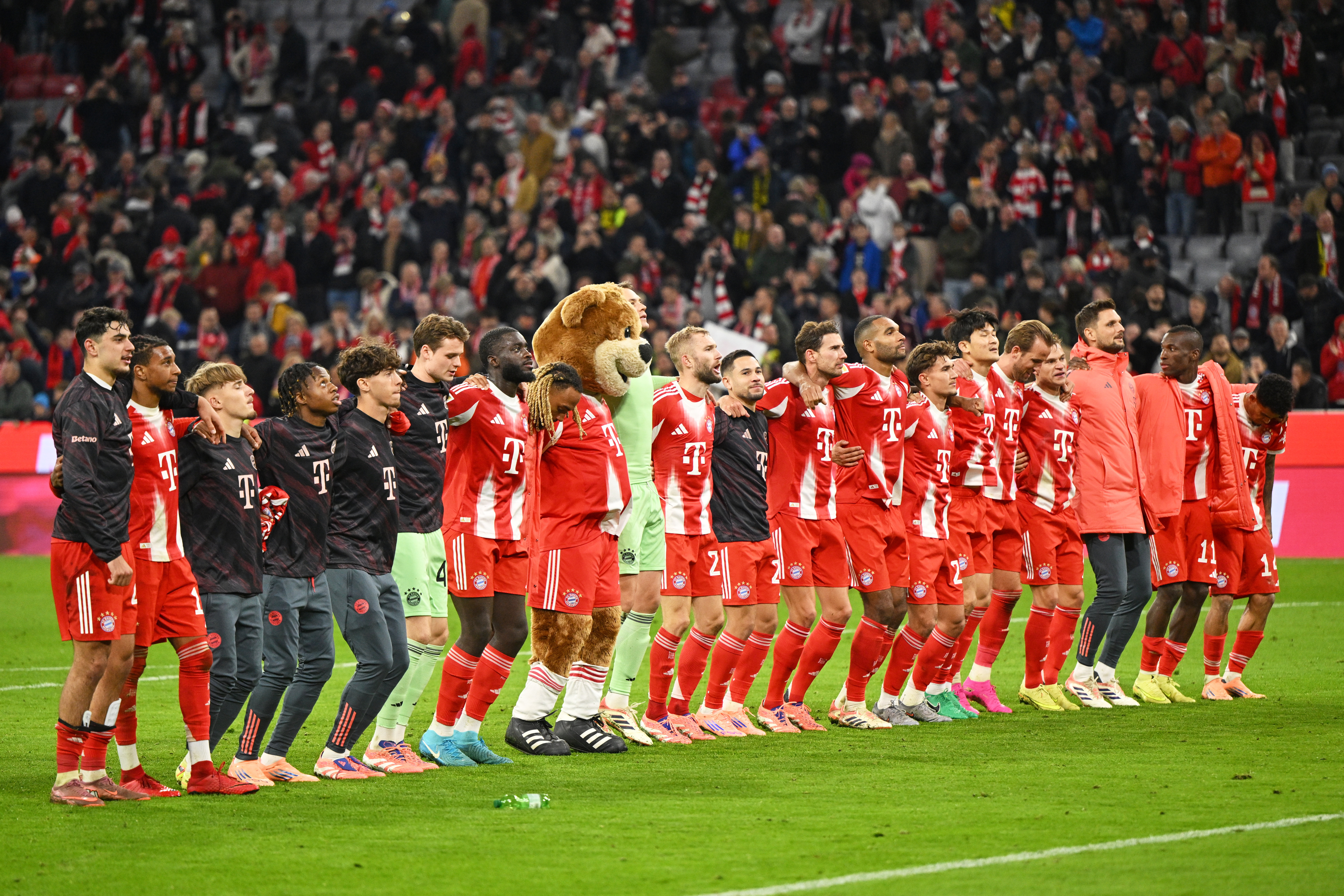 Bayern Munich players celebrate their victory after the Bundesliga soccer match between Bayern Munich and Borussia Dortmund in Munich, Germany, Saturday, Oct. 18, 2025. 