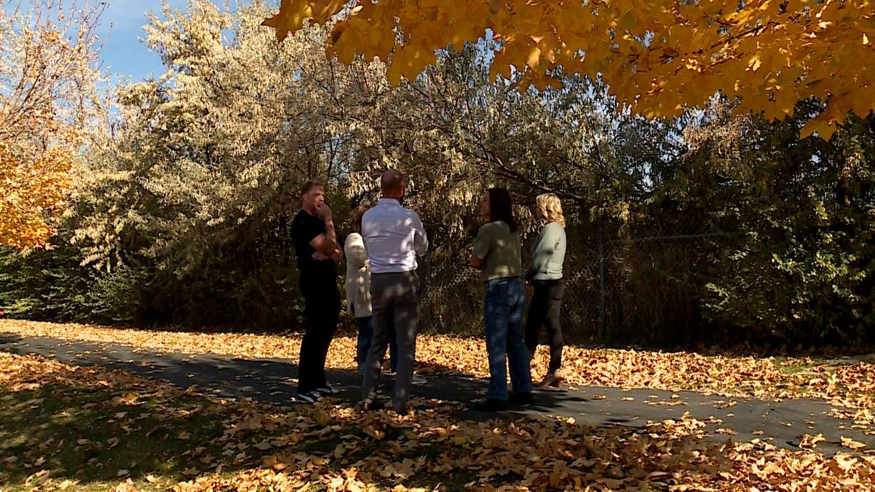 Residents of the Spring View Farms neighborhood in Bluffdale talk together on Thursday, near the site of a planned FrontRunner station.