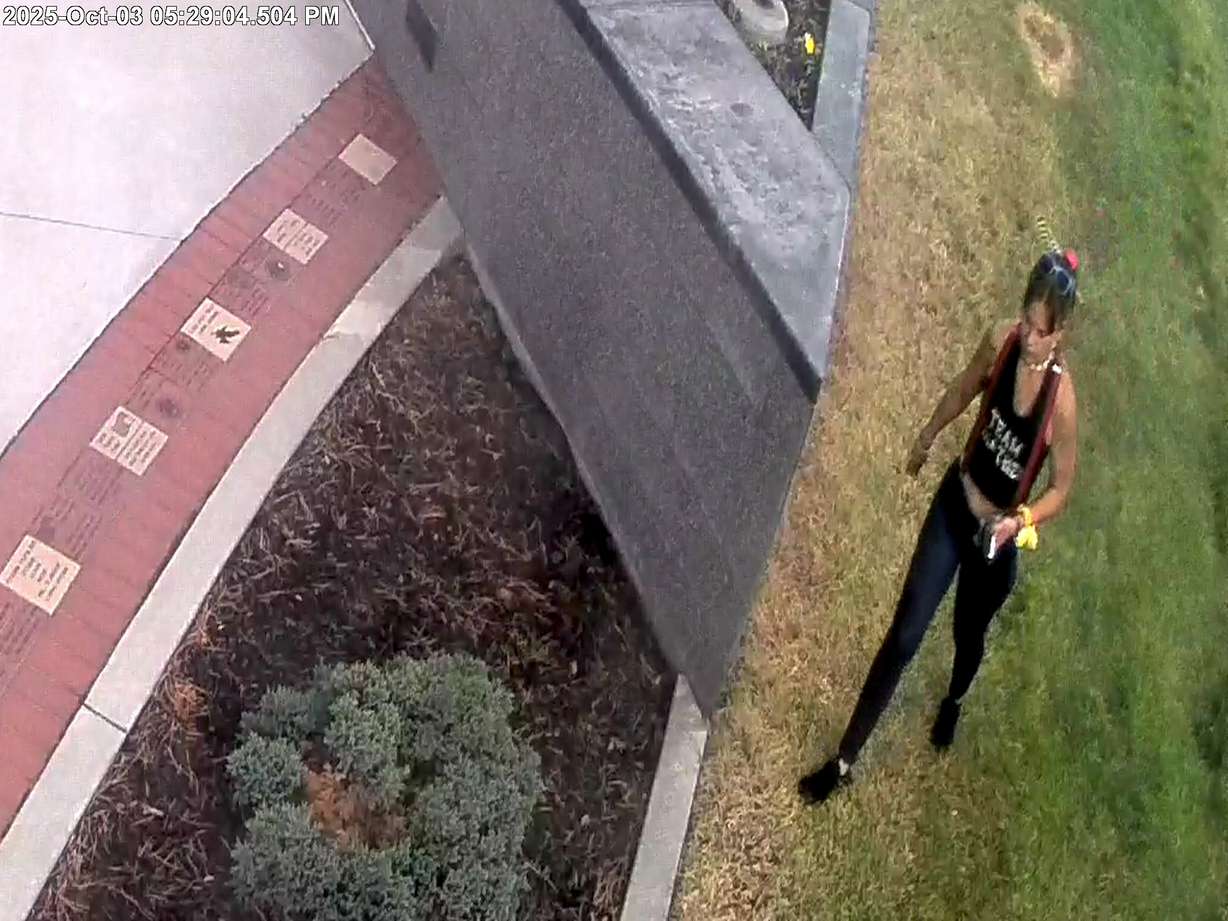A person is shown on surveillance footage near the Vietnam War Memorial Wall inside Commons park in Layton on Oct. 3. Police are asking assistance in locating the individual they suspect of vandalism.