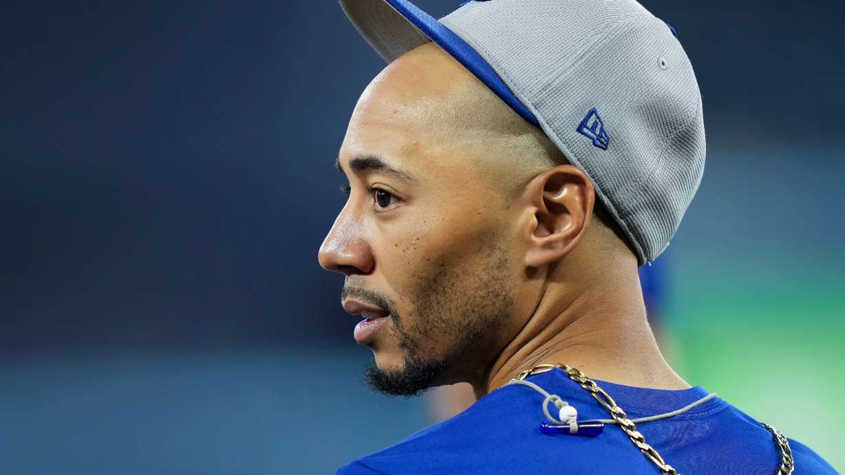 Los Angeles Dodgers shortstop Mookie Betts looks on during World Series baseball batting practice World Series in Toronto, Thursday, Oct. 30, 2025.