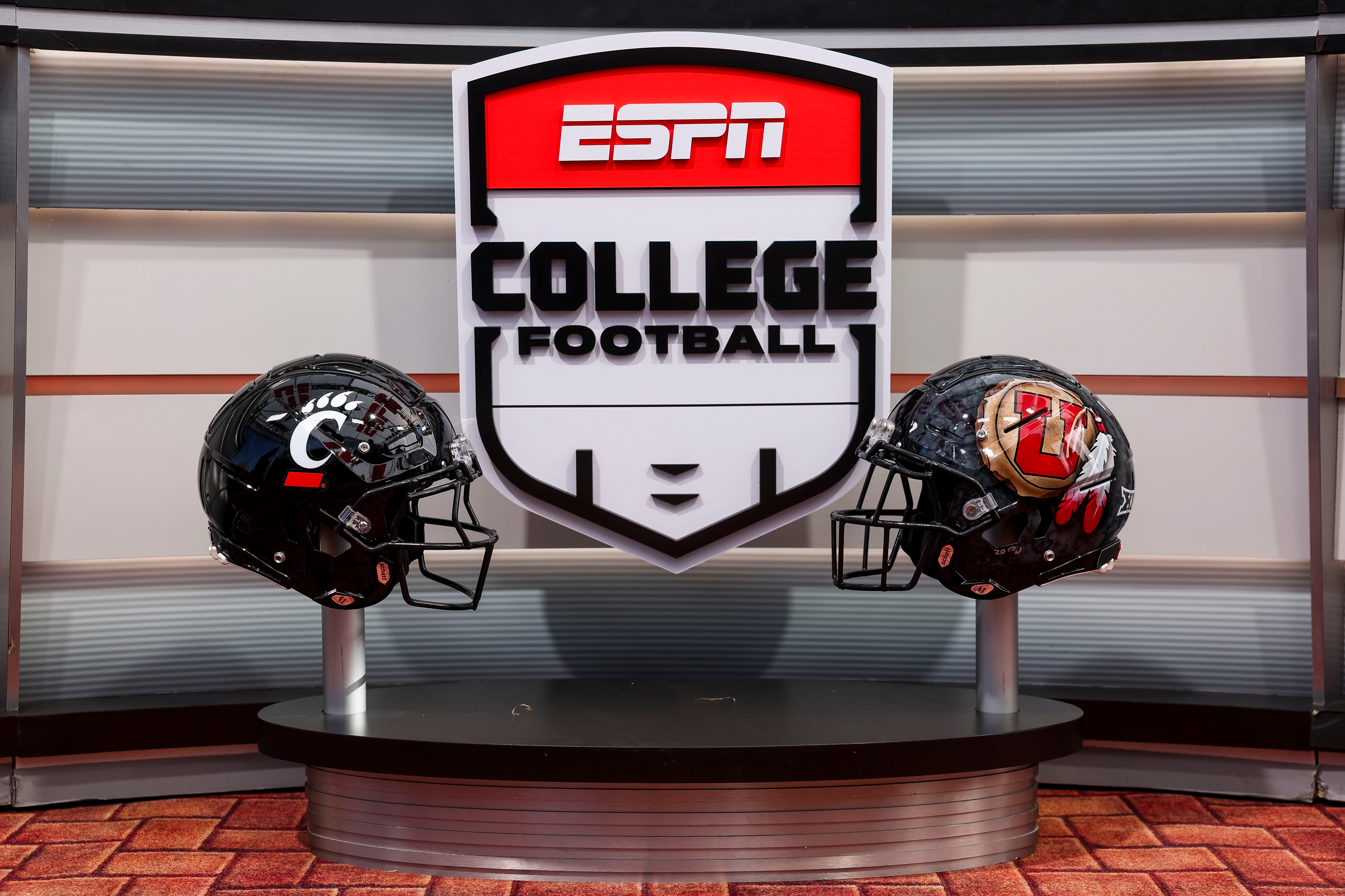 The helmets of Cincinnati and Utah are on display on the “College GameDay” set in the Presidents Circle at the University of Utah in Salt Lake City on Friday, Oct. 31, 2025.