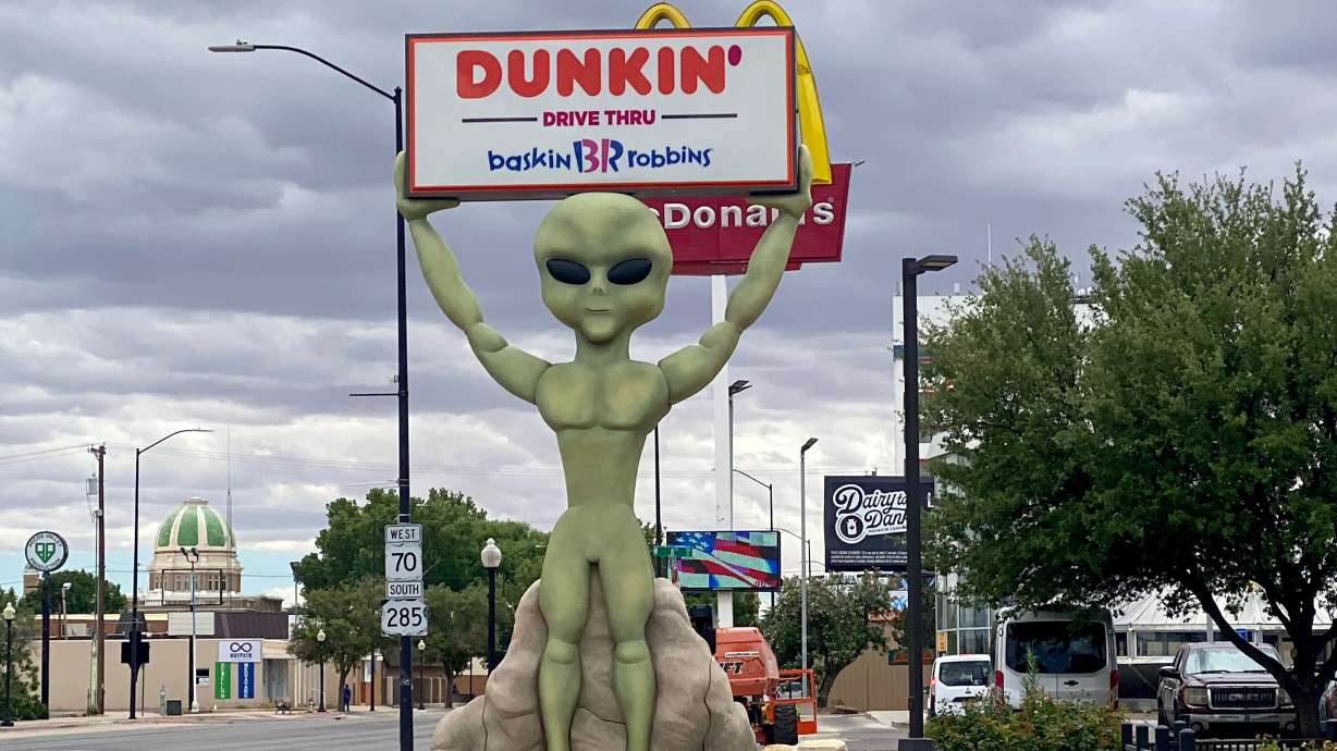 An extra large alien statue greets drivers in Roswell, New Mexico on June 3. Potential alien invaders are no longer classified by the U.S. Government as unidentified flying objects.