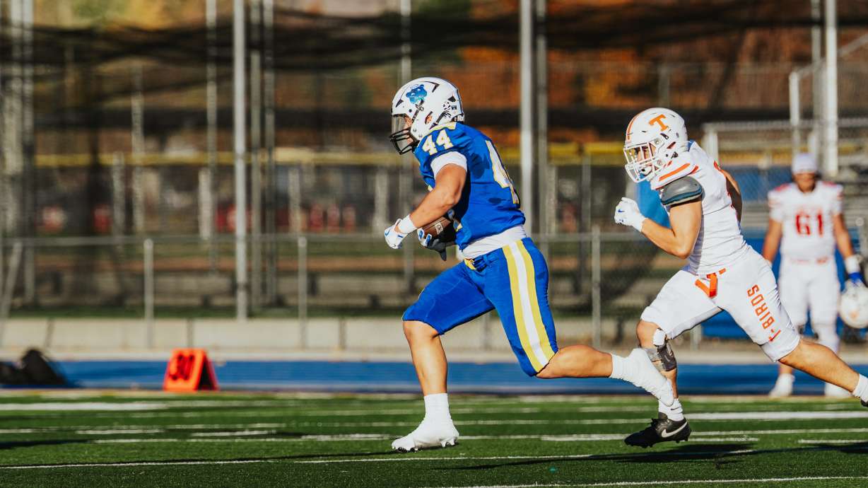 Orem's Easton Kojima runs toward the end zone during the Tigers' 5A state playoff game against Timpview, Friday, Oct. 31, 2025 in Orem, Utah.
