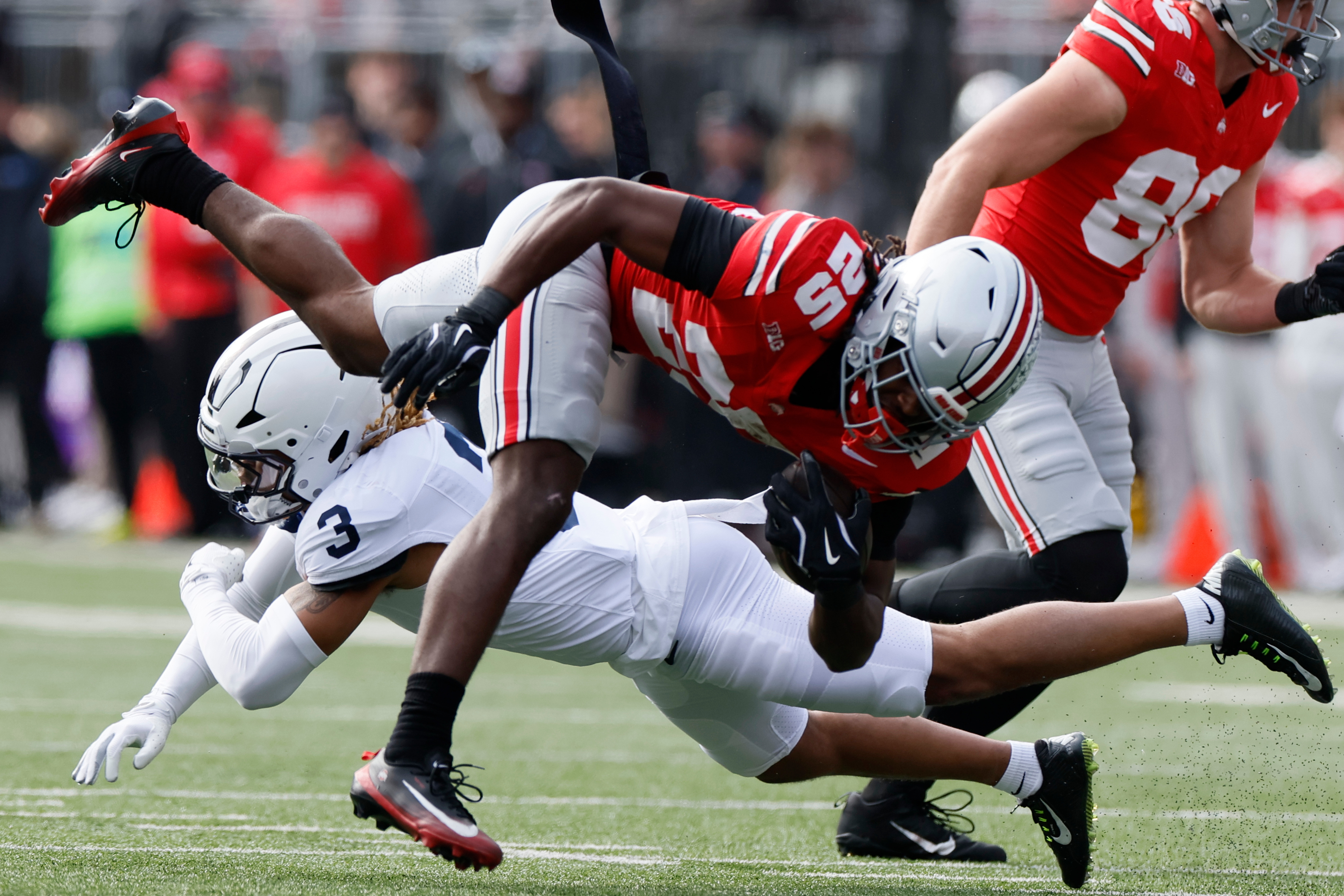 Ohio State running back Bo Jackson, top, is tackled by Penn State defensive back Antoine Belgrave-Shorter during the first half of an NCAA college football game, Saturday, Nov. 1, 2025, in Columbus, Ohio. 