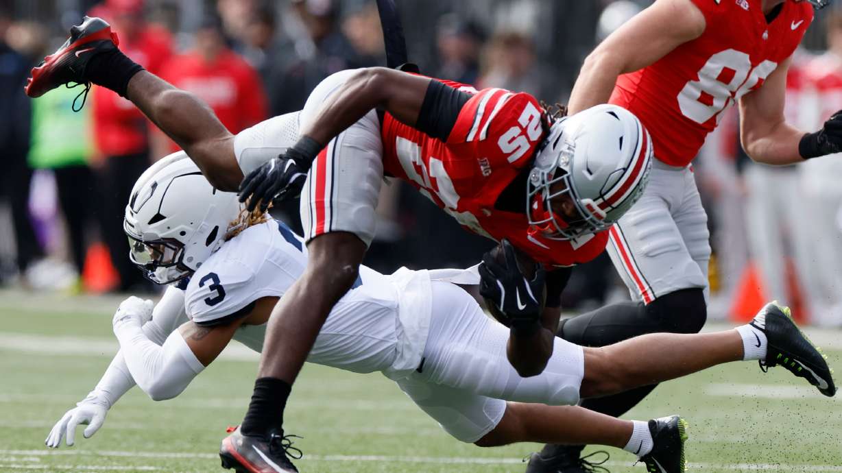 Ohio State running back Bo Jackson, top, is tackled by Penn State defensive back Antoine Belgrave-Shorter during the first half of an NCAA college football game, Saturday, Nov. 1, 2025, in Columbus, Ohio.