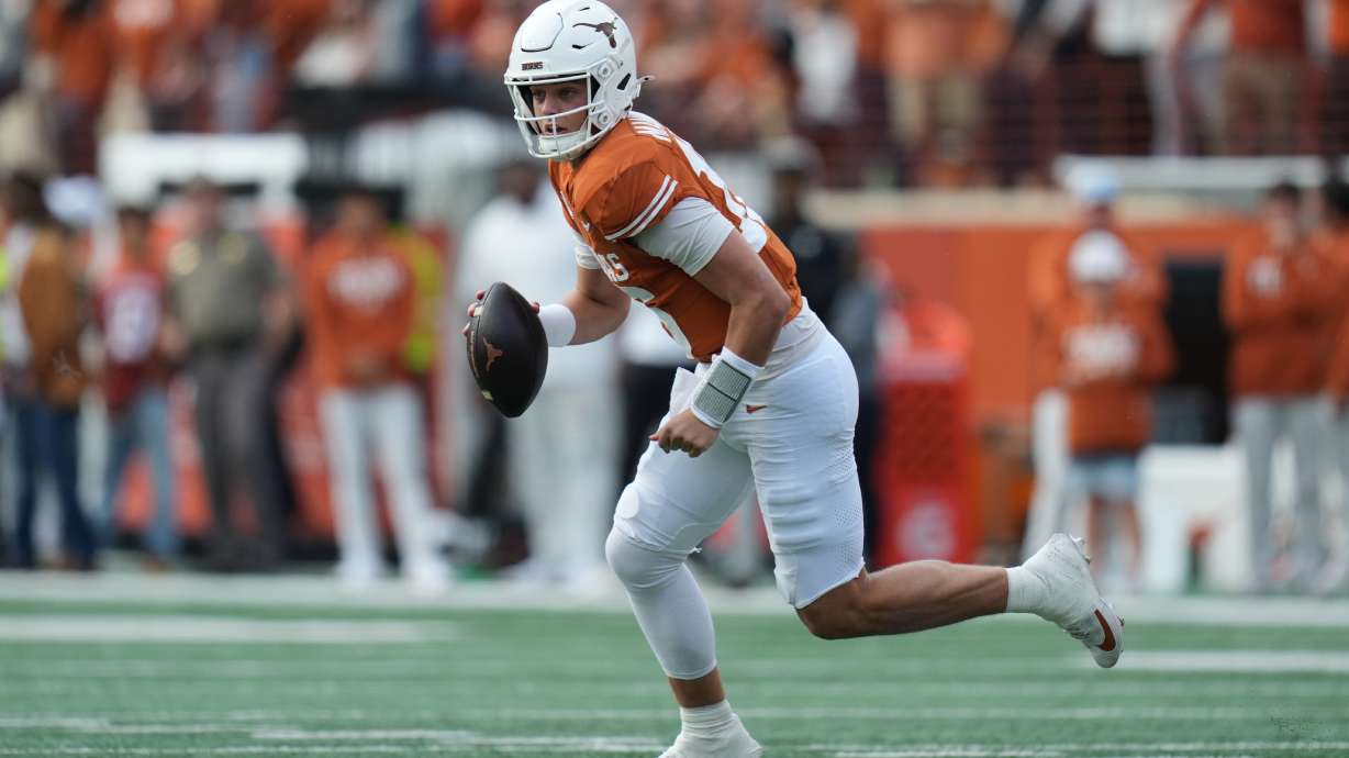 Texas quarterback Arch Manning (16) runs as he looks to throw against Vanderbilt during the first half of an NCAA college football game in Austin, Texas, Saturday, Nov. 1, 2025.